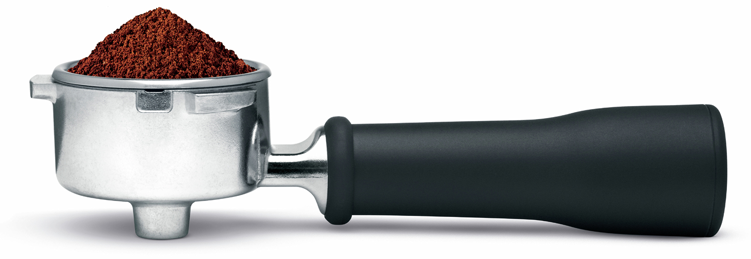 A silver portafilter filled with ground coffee, with a black handle, lying horizontally.