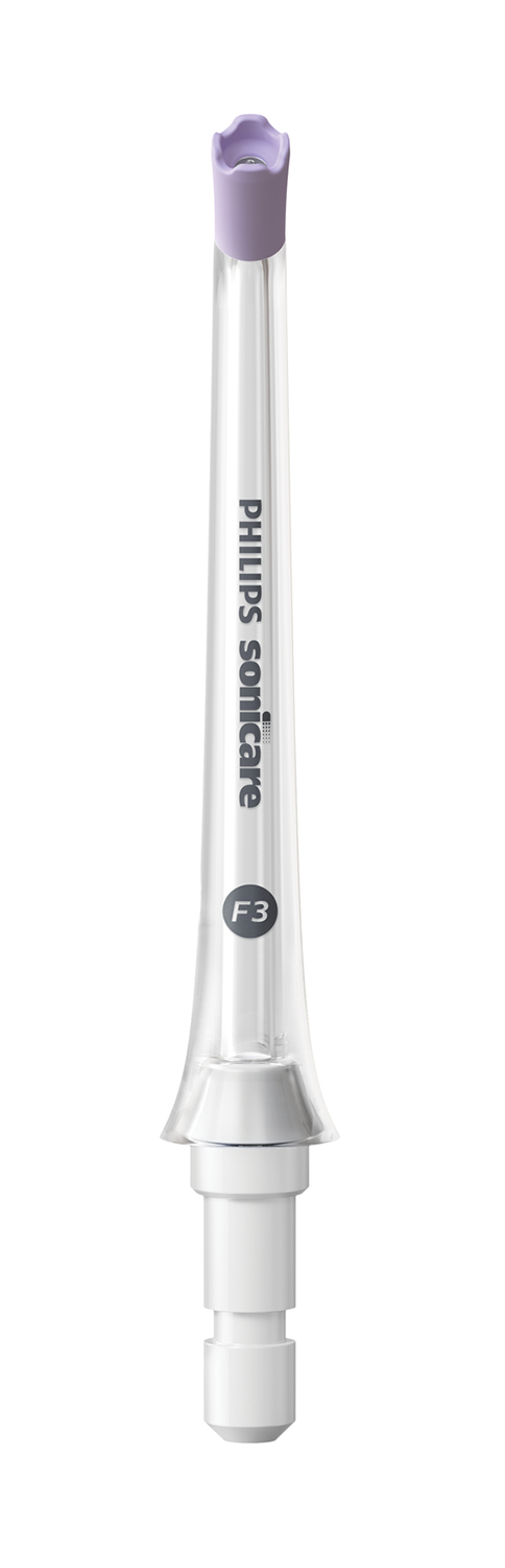 A white Philips Sonicare F3 toothbrush head with a purple bristle area.