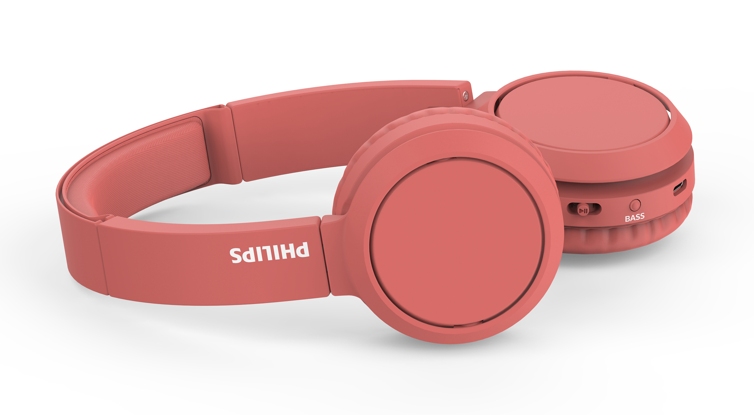 Yanında 'PHILIPS' yazan pembe Philips kulaklıklar.