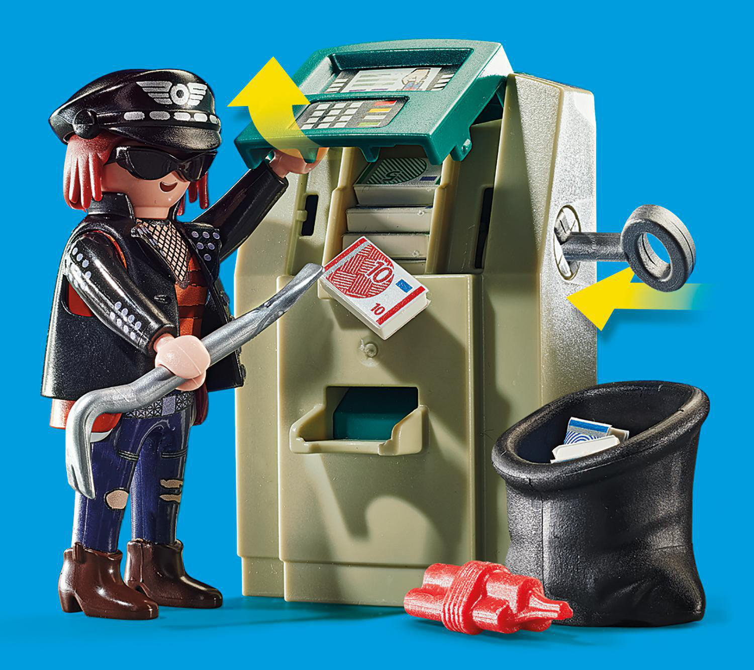 Eine Spielfigur bricht mit einem Brecheisen einen Geldautomaten auf. Geld und eine schwarze Tasche liegen am Boden. Ein Schlüssel steckt im Automaten.