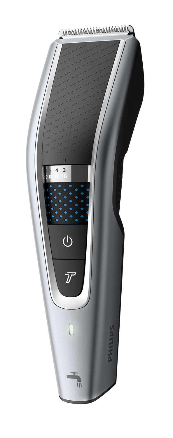 Zilveren en zwarte Philips haartrimmer met een digitaal display en aan/uit-knop.