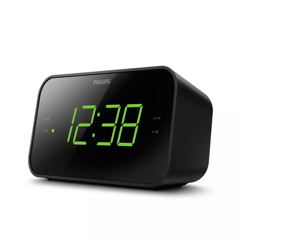 Schwarzer digitaler Philips Wecker mit grüner Anzeige, die 12:38 zeigt. Isoliert auf weißem Hintergrund.