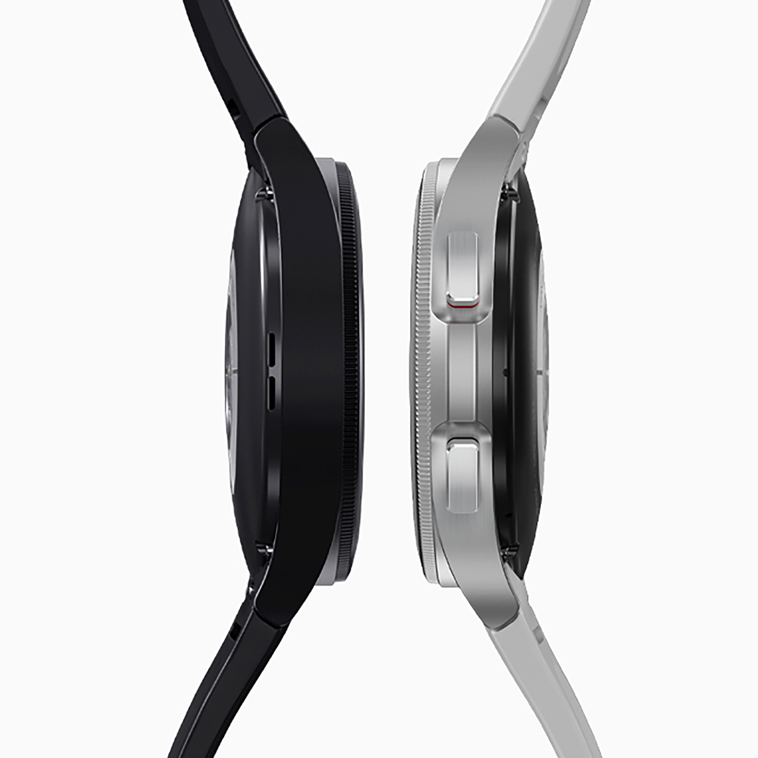 Dos smartwatches lado a lado, una negra y otra plateada, con correas negras y blancas.