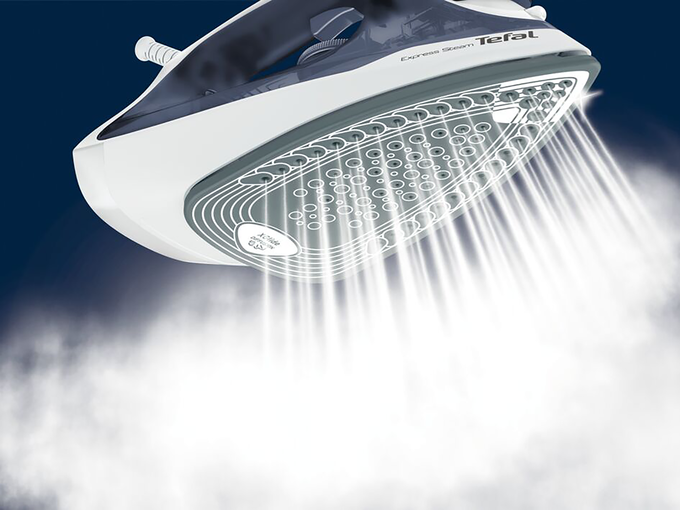An iron releasing steam. The iron is white and gray, with steam coming from the bottom.