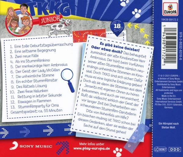 Rückseite eines Buches mit Text und Bildern, mit einer Lupe.