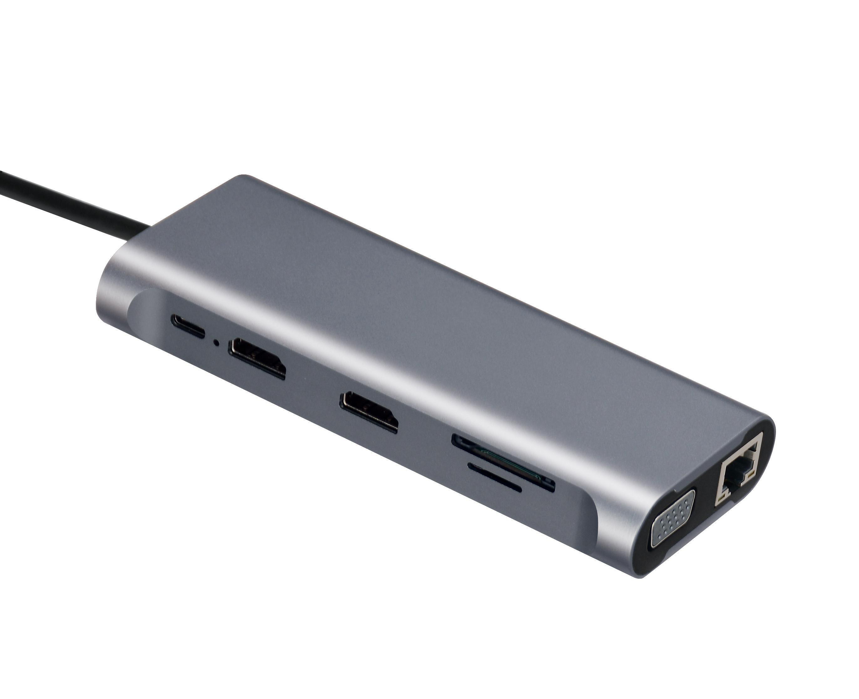 Ein grauer Multiport-Adapter mit Anschlüssen. Er hat verschiedene Anschlüsse, darunter USB-C, HDMI und Ethernet.