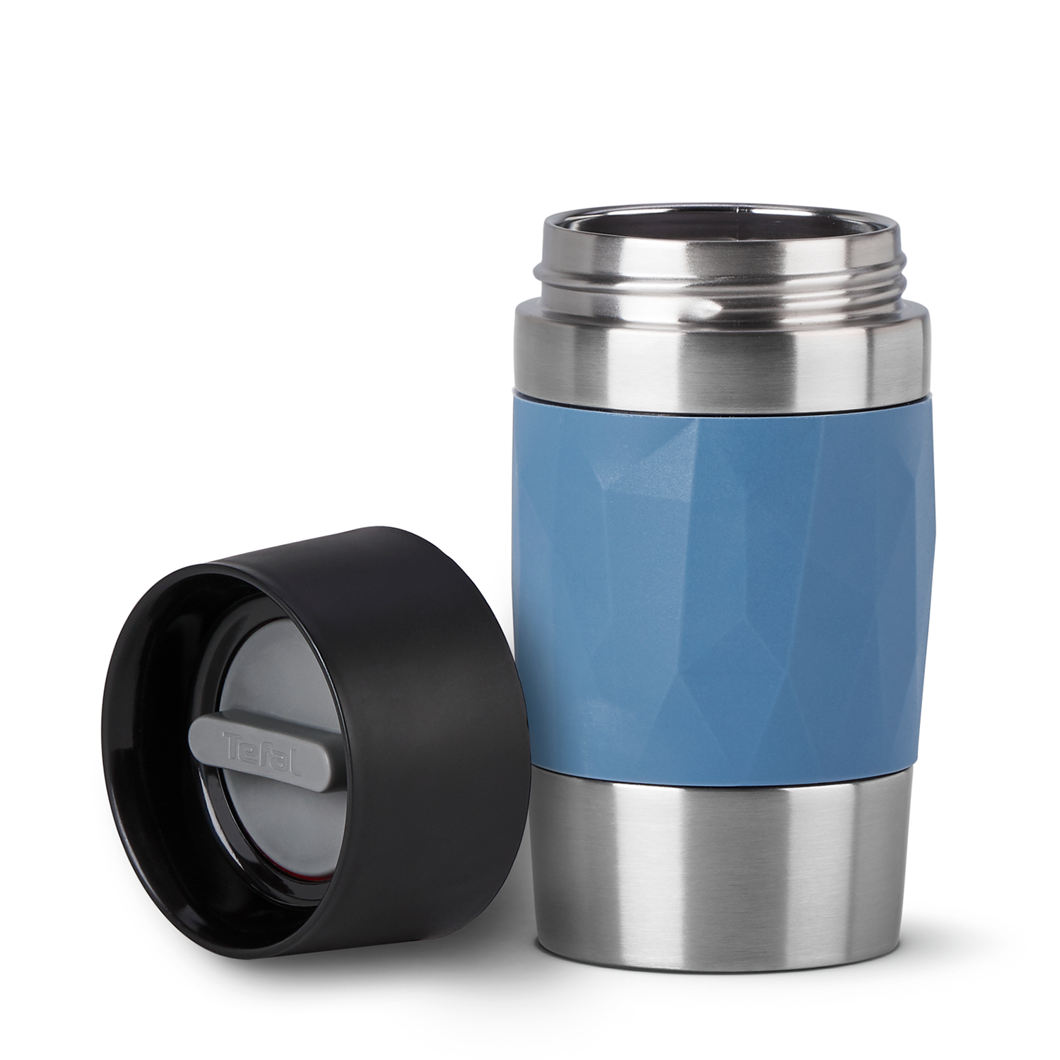 Blue and silver travel mug open, showing the interior for drinking beverages.