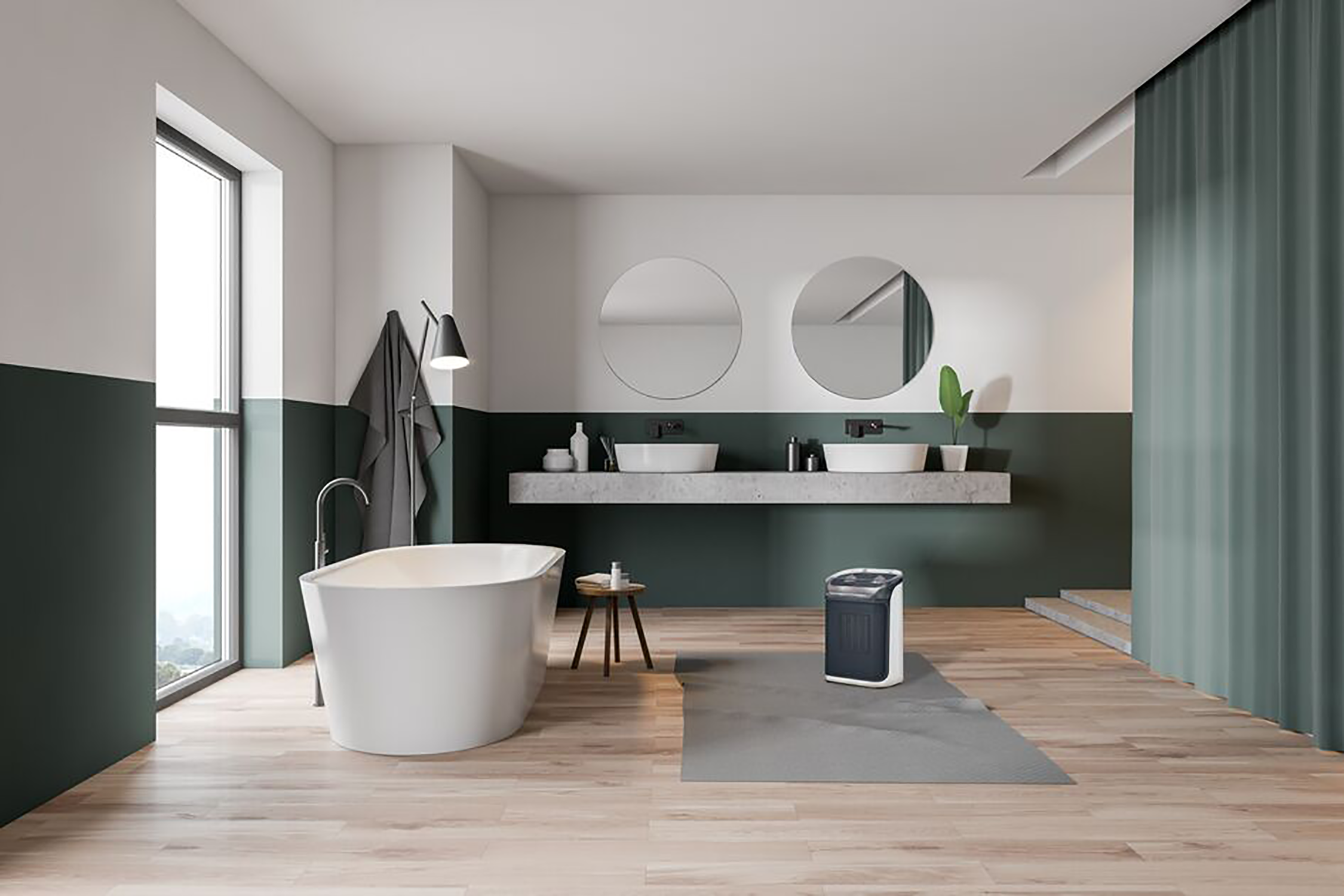 Badkamer met bad, twee wastafels en een wasmachine. Groene en witte muren, houten vloer en groot raam.