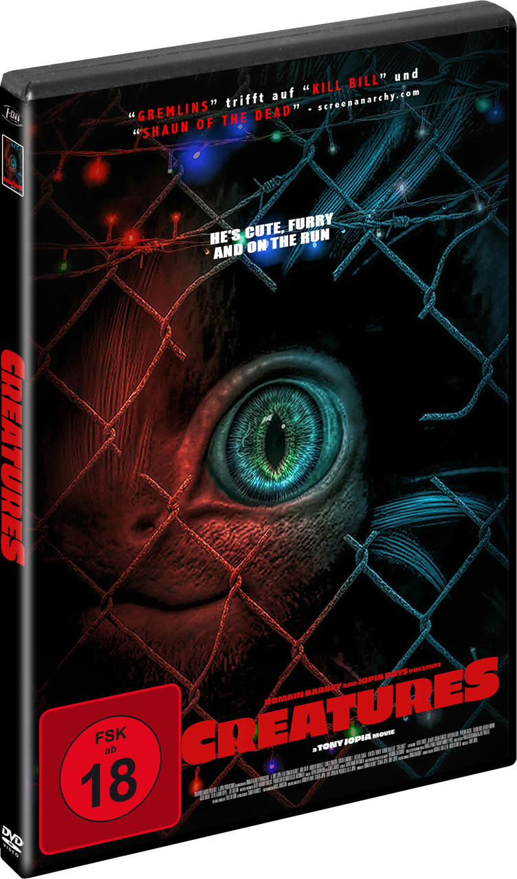DVD-Hülle mit dem Film 'Creatures'. Ein Monsterauge ist sichtbar, und ein Zaun im Hintergrund.