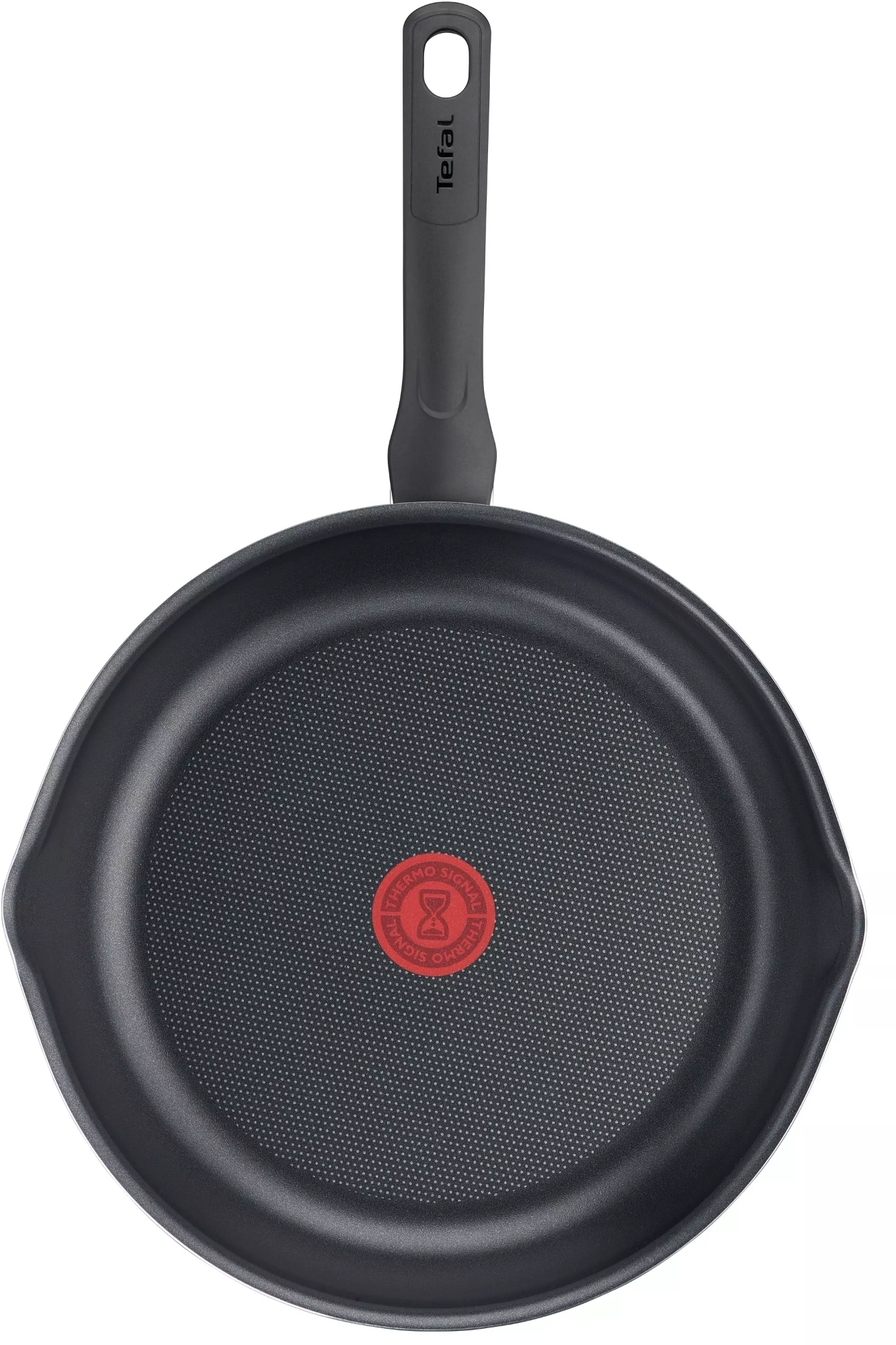 Poêle Tefal. Noire, avec cercle rouge au centre. Vue de dessus.