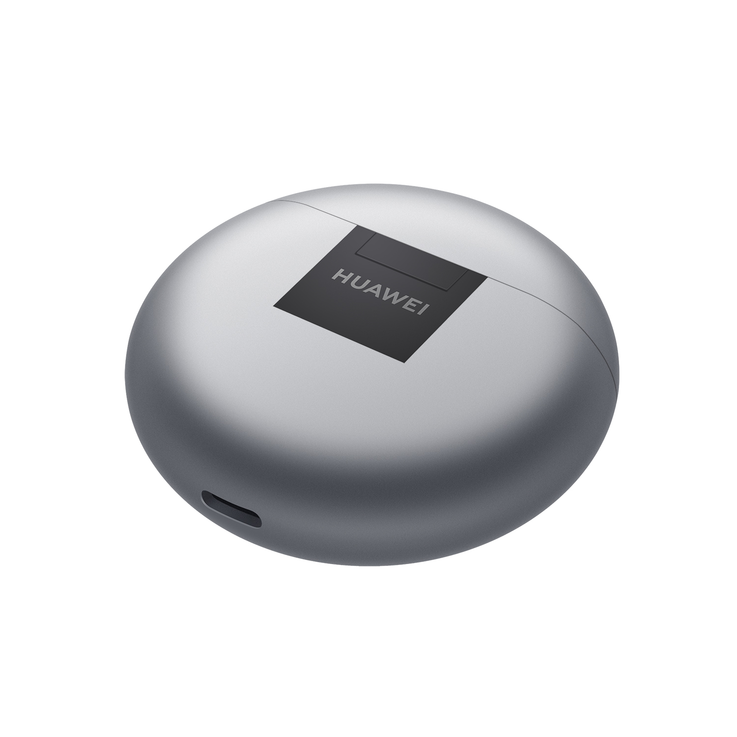 Un estuche de carga plateado y circular con una tapa negra y el logotipo de Huawei.