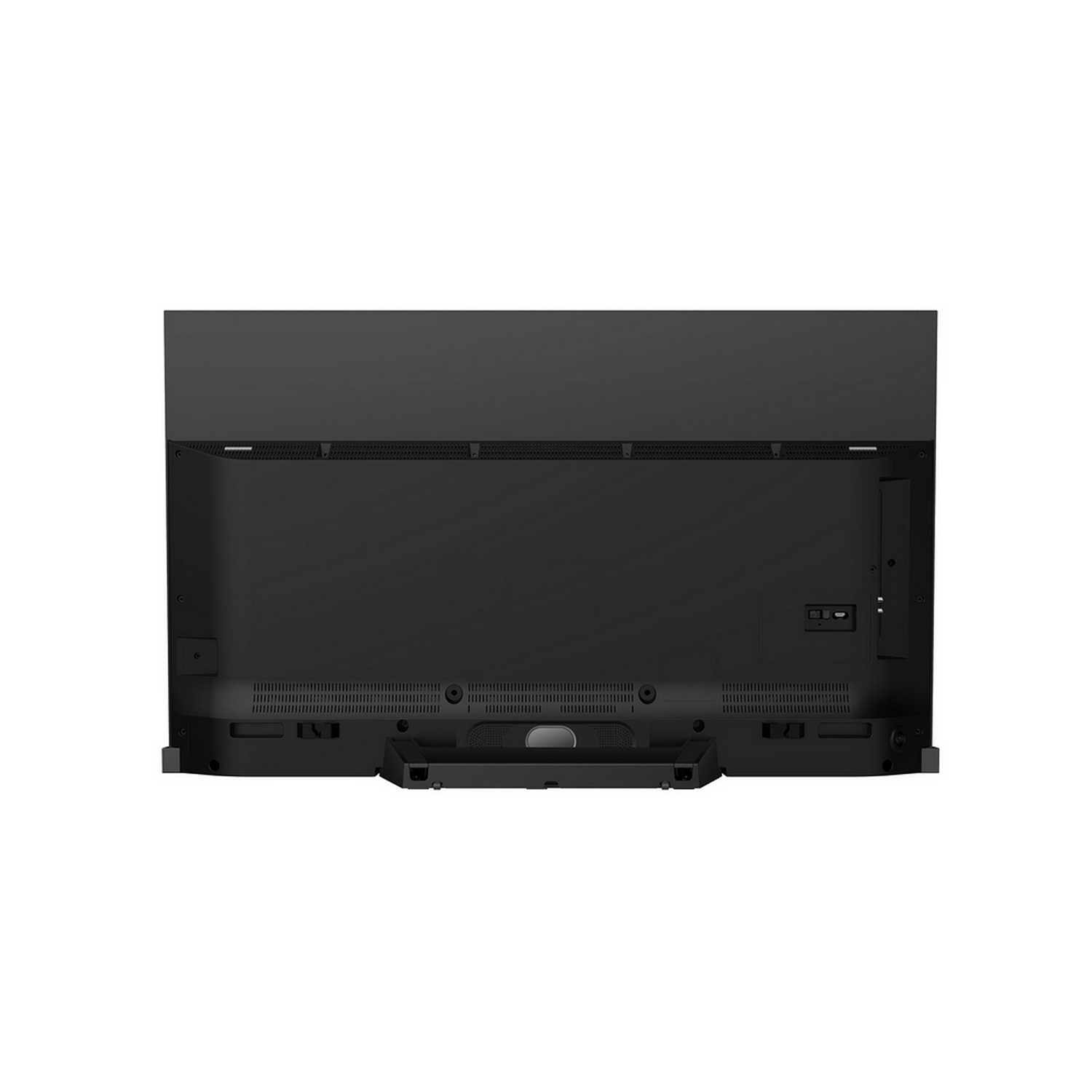 La parte trasera de un televisor negro. Hay varios puertos y rejillas de ventilación visibles.