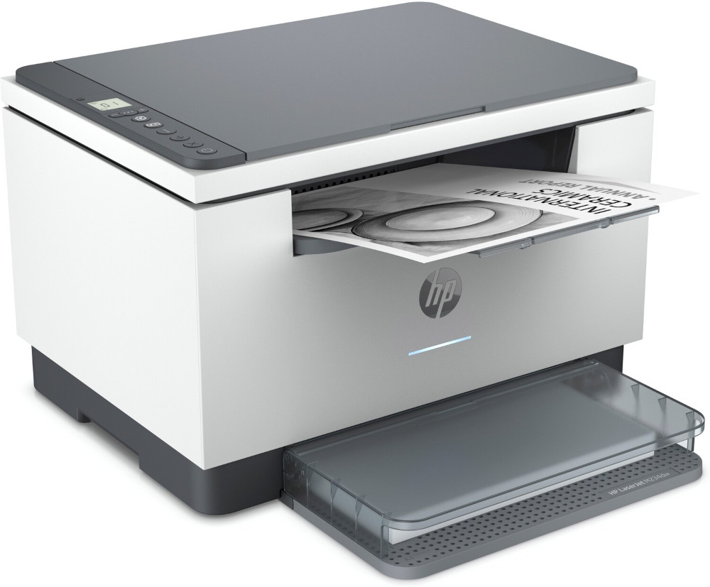 A white and gray HP laser printer is printing a document. The output tray is open, and a printed paper is visible.