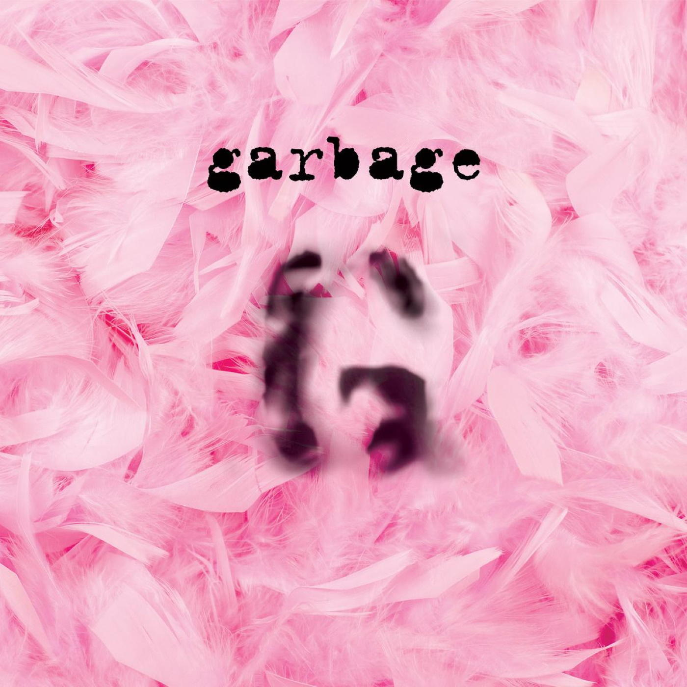 A Garbage album borítója. Rózsaszín tollak homályos fekete 'garbage' felirattal.