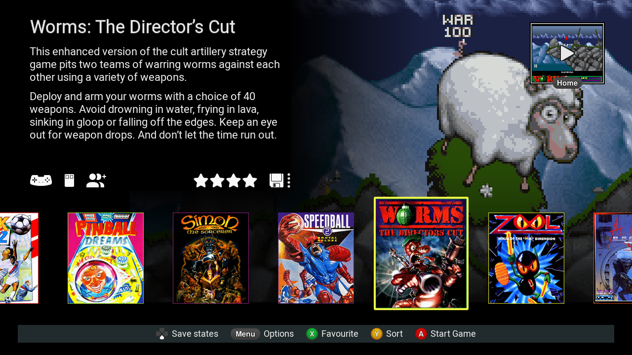 Spieloberfläche: Liste der Spielcover. Text 'Worms: The Director's Cut' ist sichtbar. Schaf im Hintergrund.