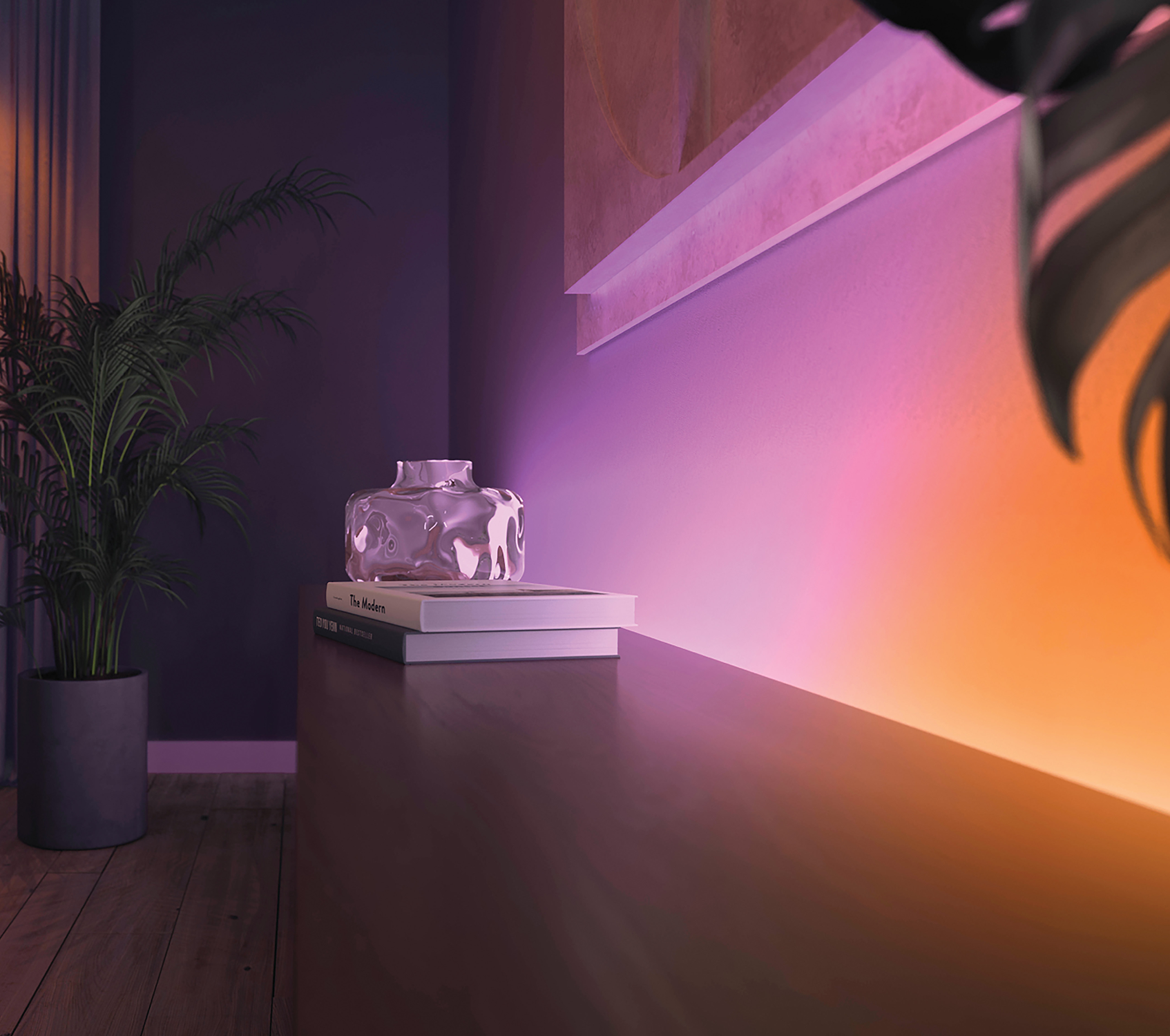 Een kamer met een vaas op boeken, een plant en een muur met gradiëntverlichting.