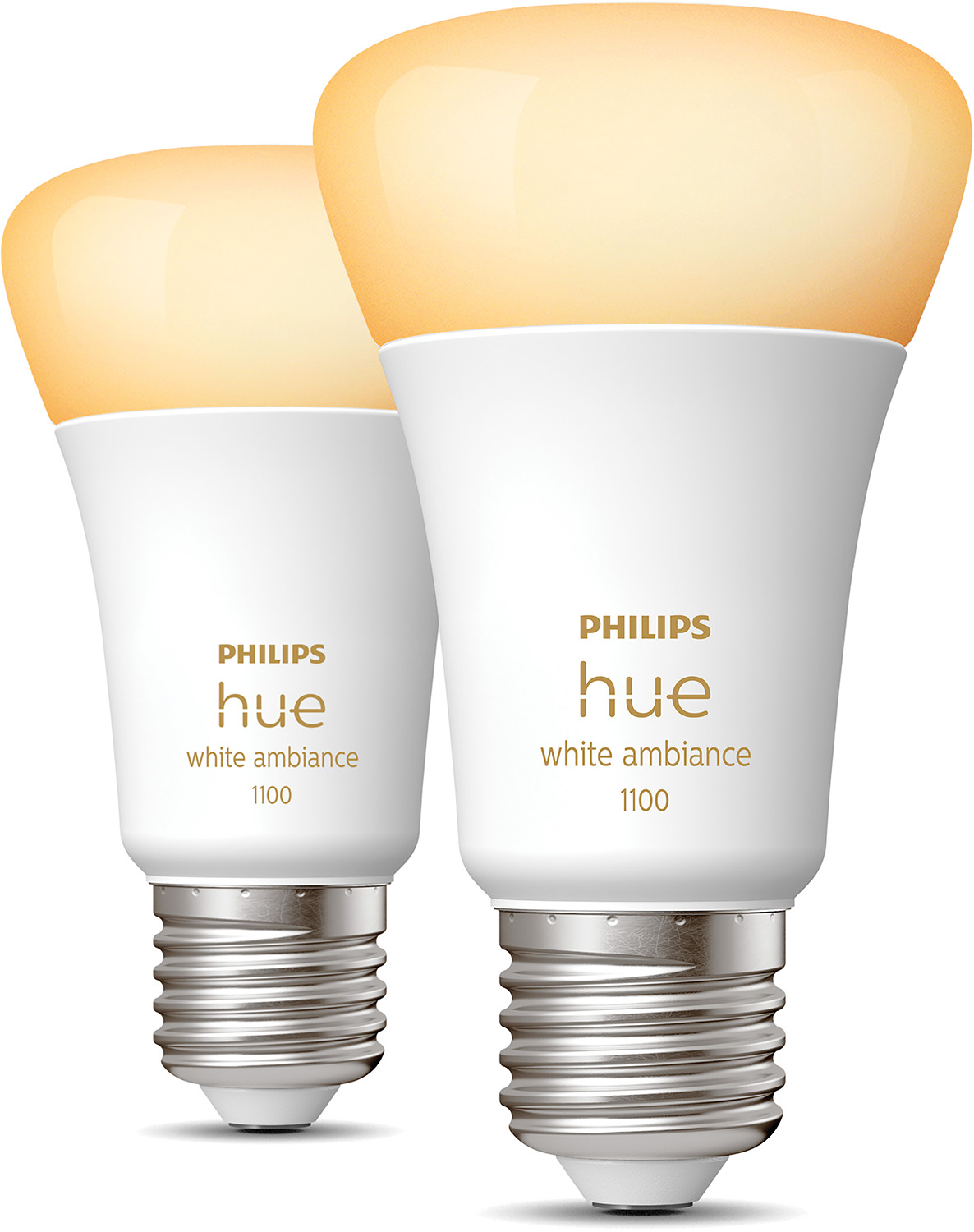 Two white Philips Hue smart light bulbs with yellow light.