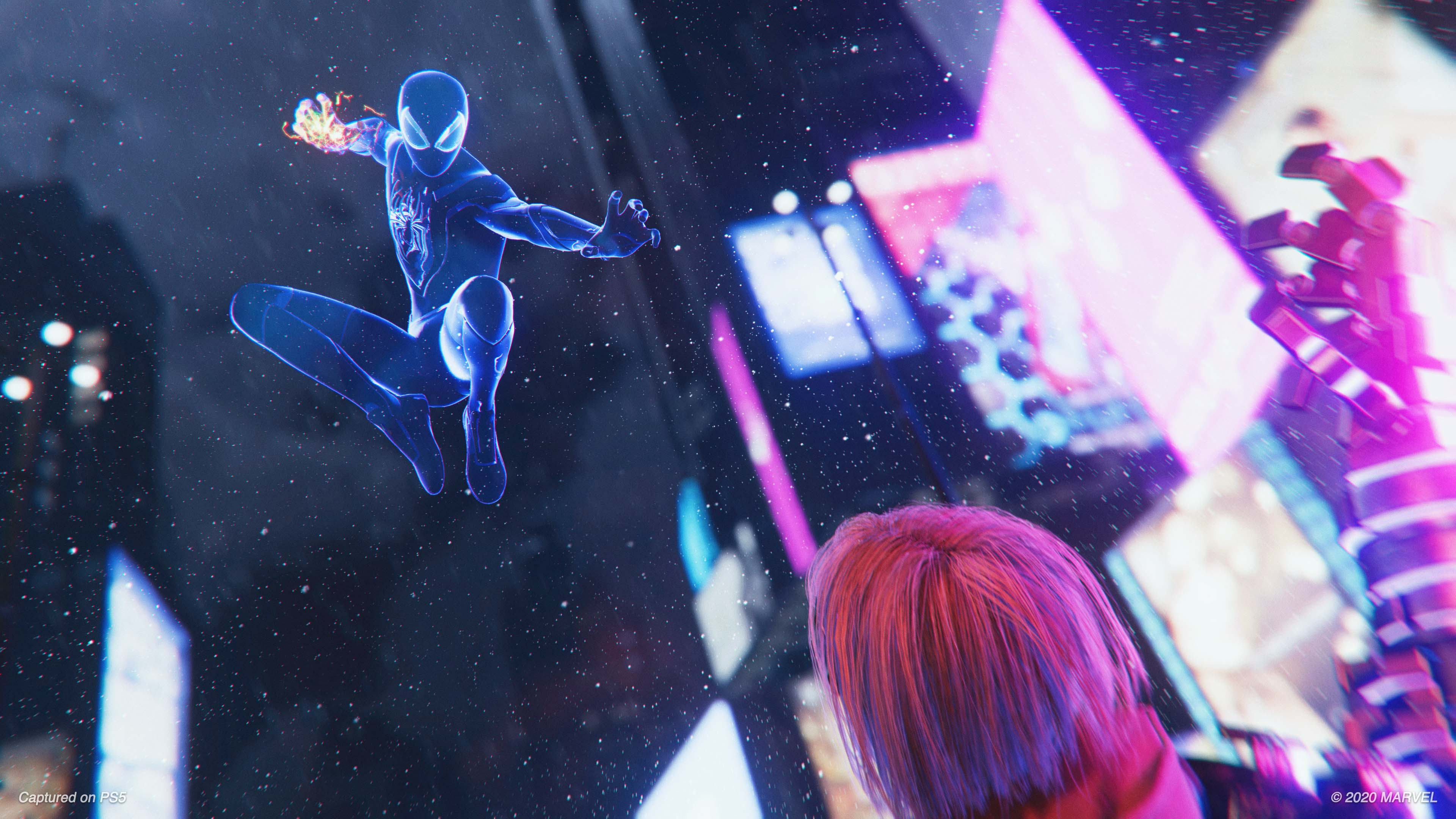 Spider-Man in a blue and black suit jumping in a city, with a girl in the foreground.