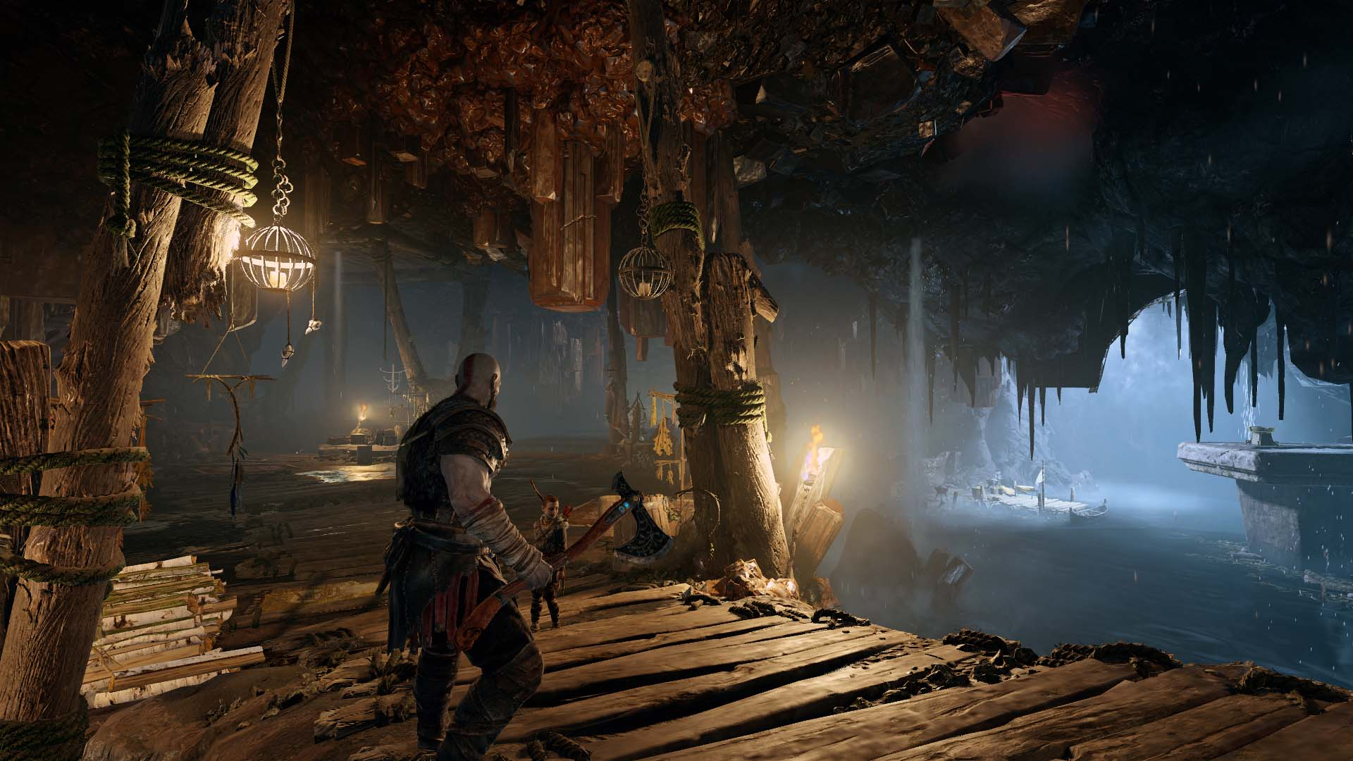 A character in a cave, holding an axe. The cave has water and hanging structures.