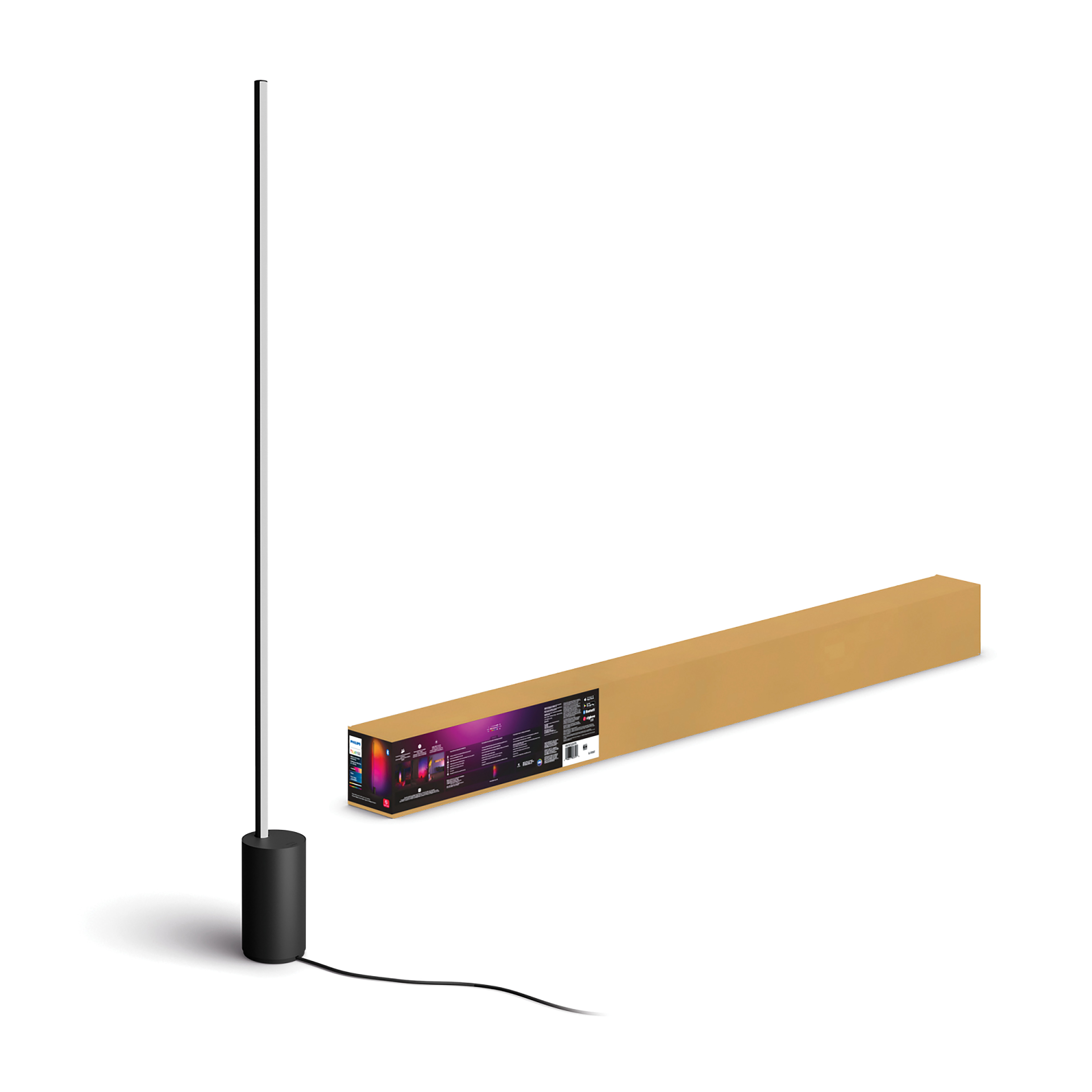 A black lamp with a long stem and a rectangular box with a picture on it.