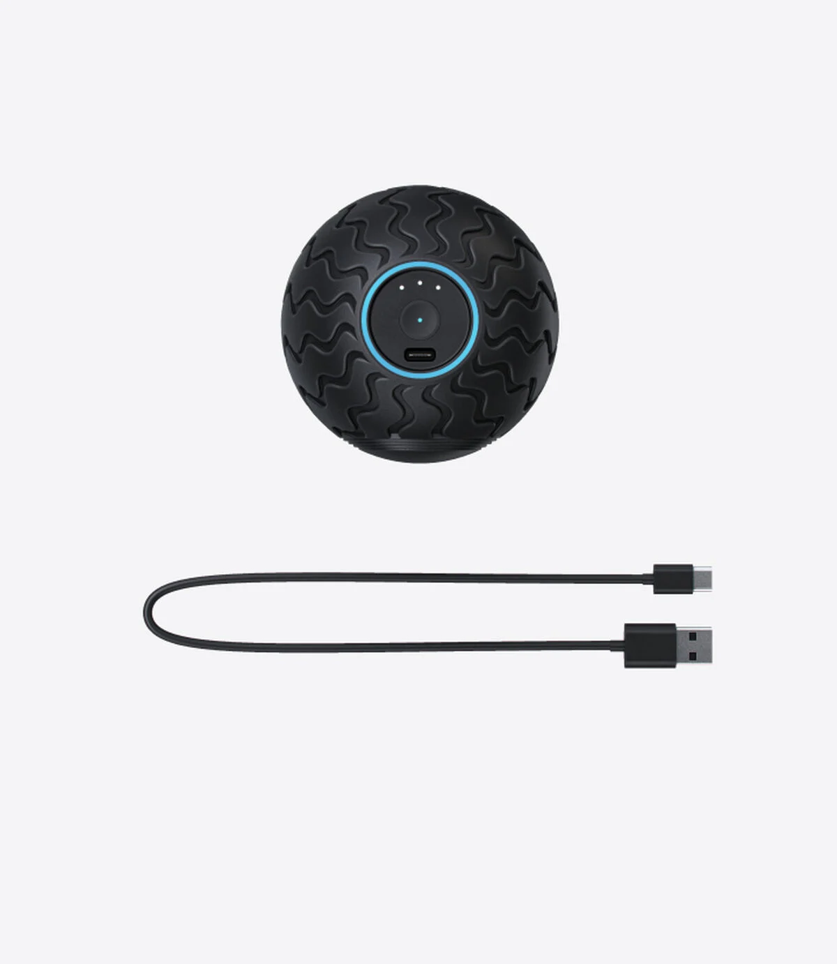 Schwarzer vibrierender Massageball mit einem Ladekabel.