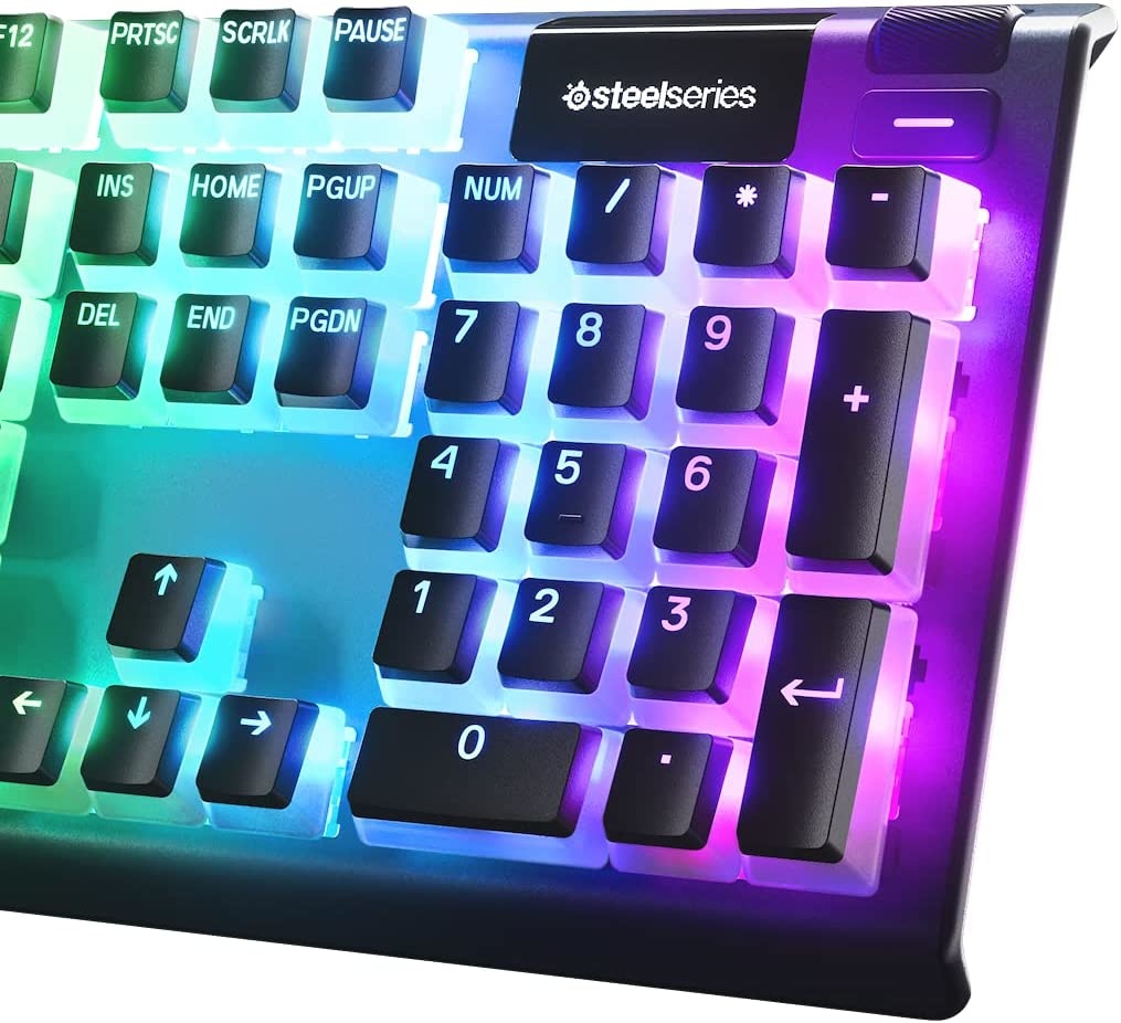 Beyaz tuşlu ve steelseries logolu arkadan aydınlatmalı bir klavye.