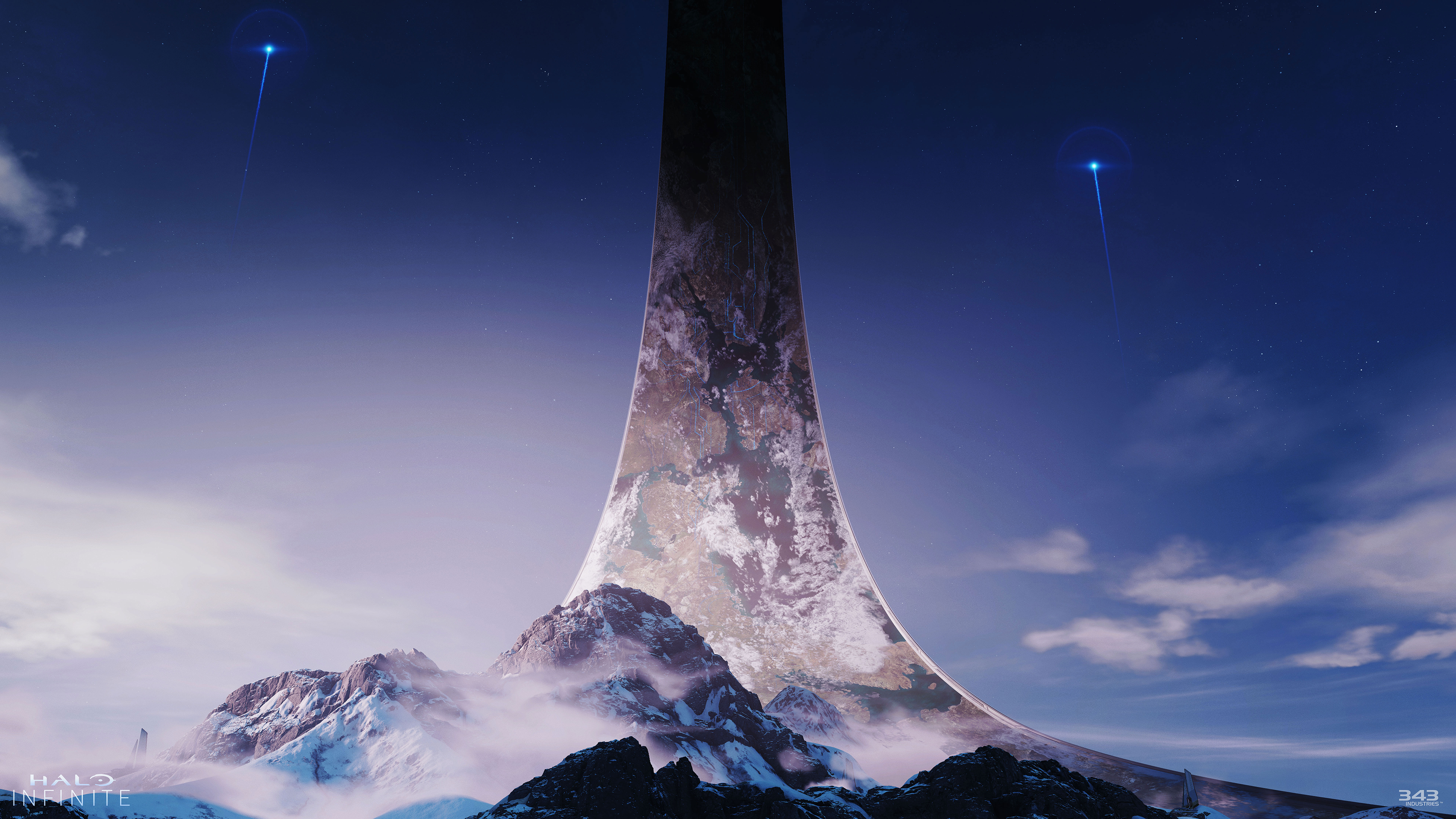 Scène Halo Infinite : structure annulaire dans le ciel au-dessus des montagnes, deux lumières bleues.