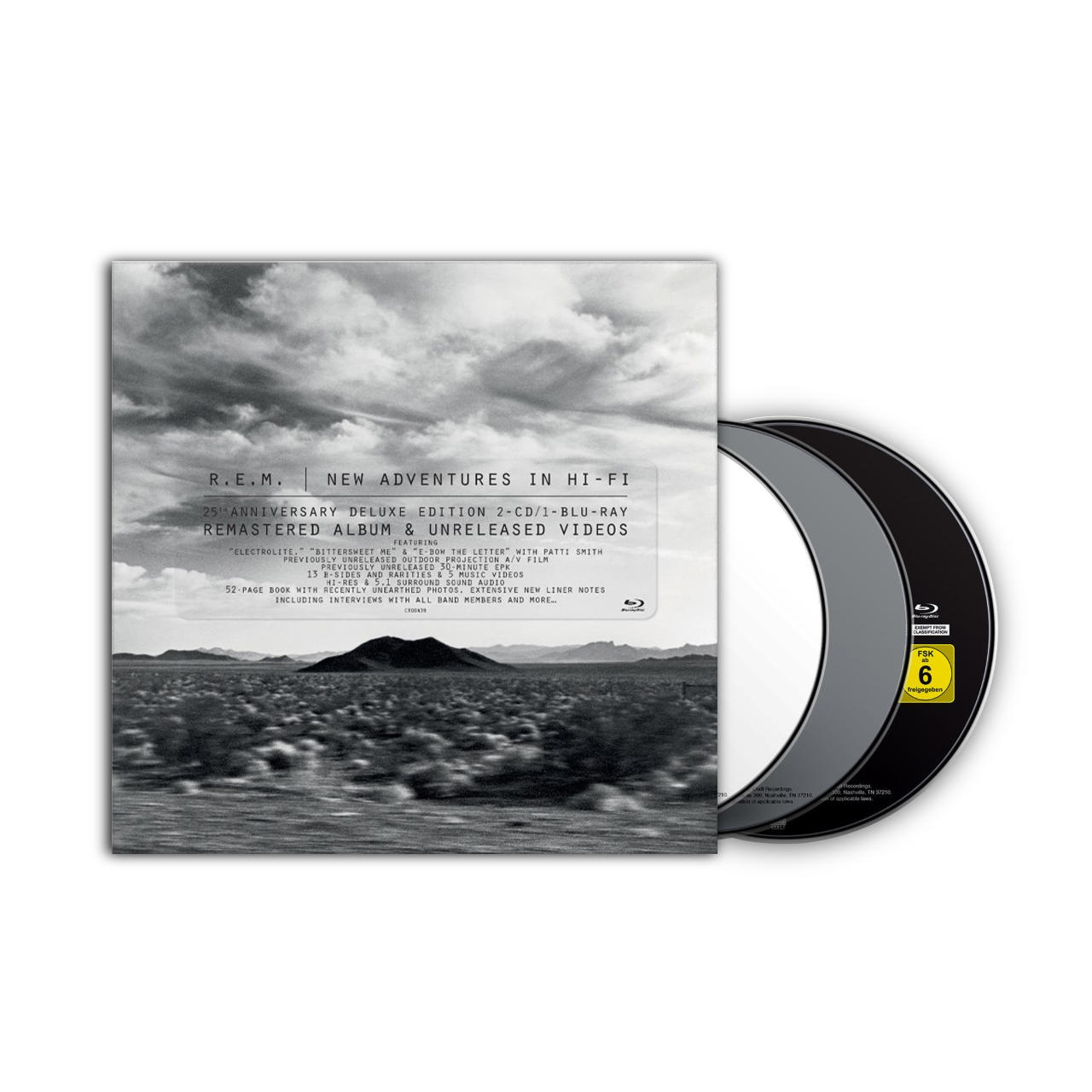 Een CD en hoes met album artwork, tegen een woestijnlandschap.