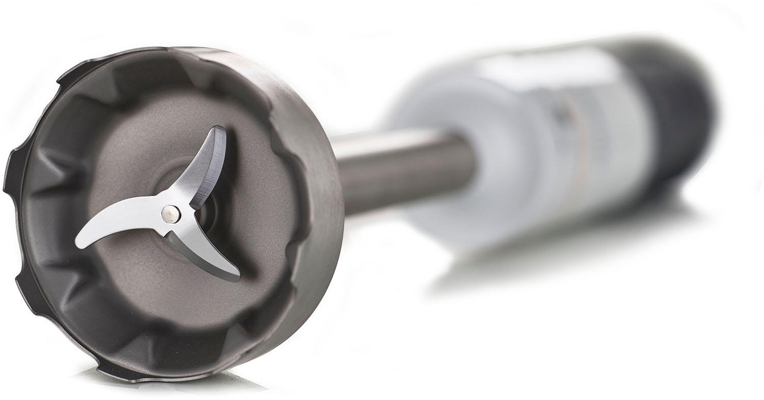 Close-up of a silver immersion blender with blades on a white background.