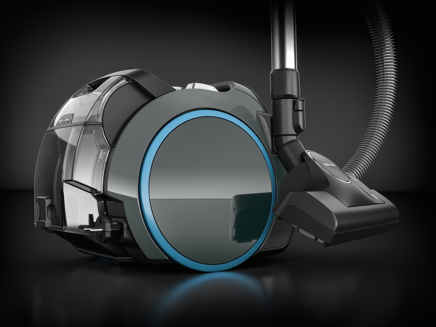 Black and grey vacuum cleaner against a black backdrop. The design emphasizes a circular element.