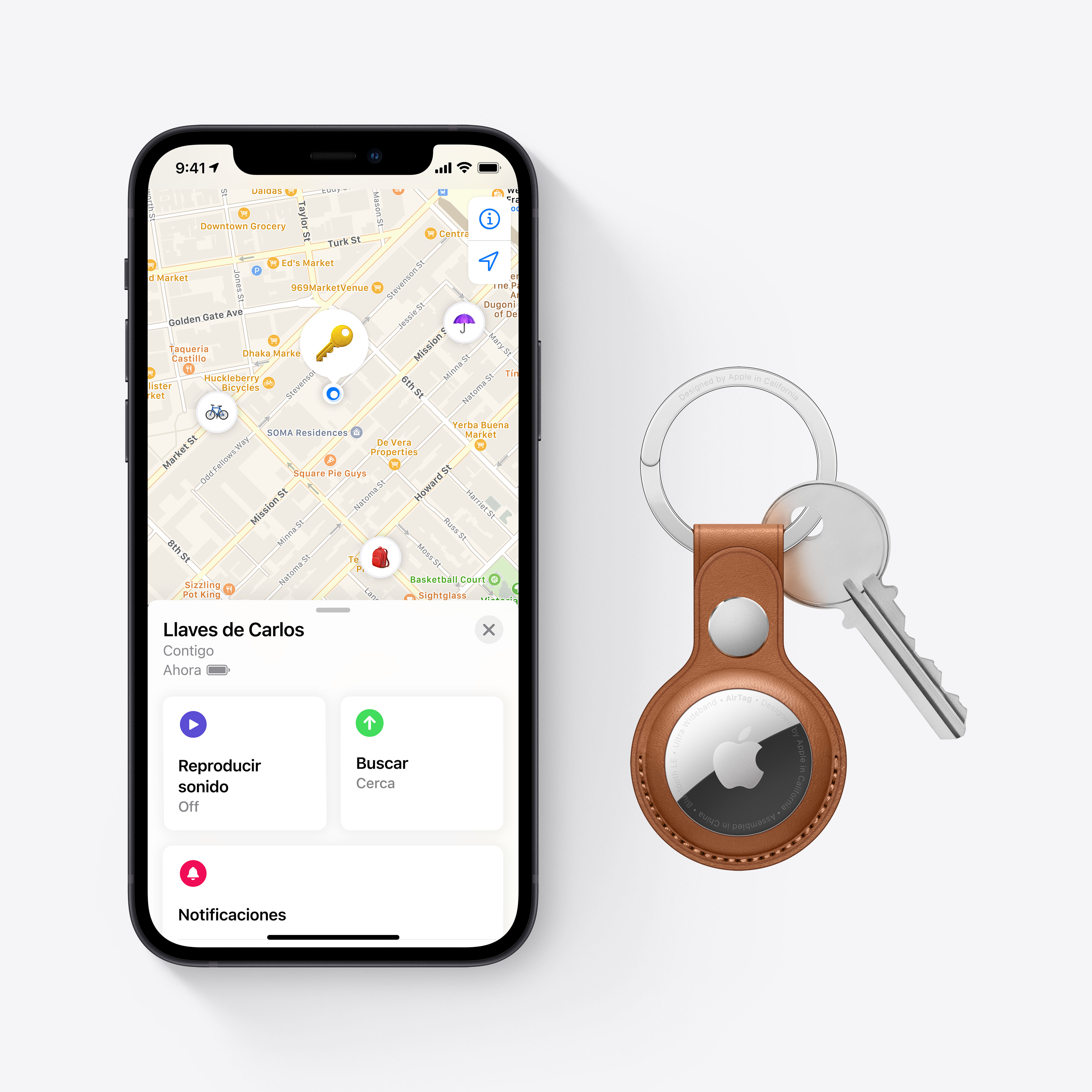 Un smartphone muestra un mapa con una etiqueta de llave y dos llaves. También se muestra una etiqueta de llave marrón.