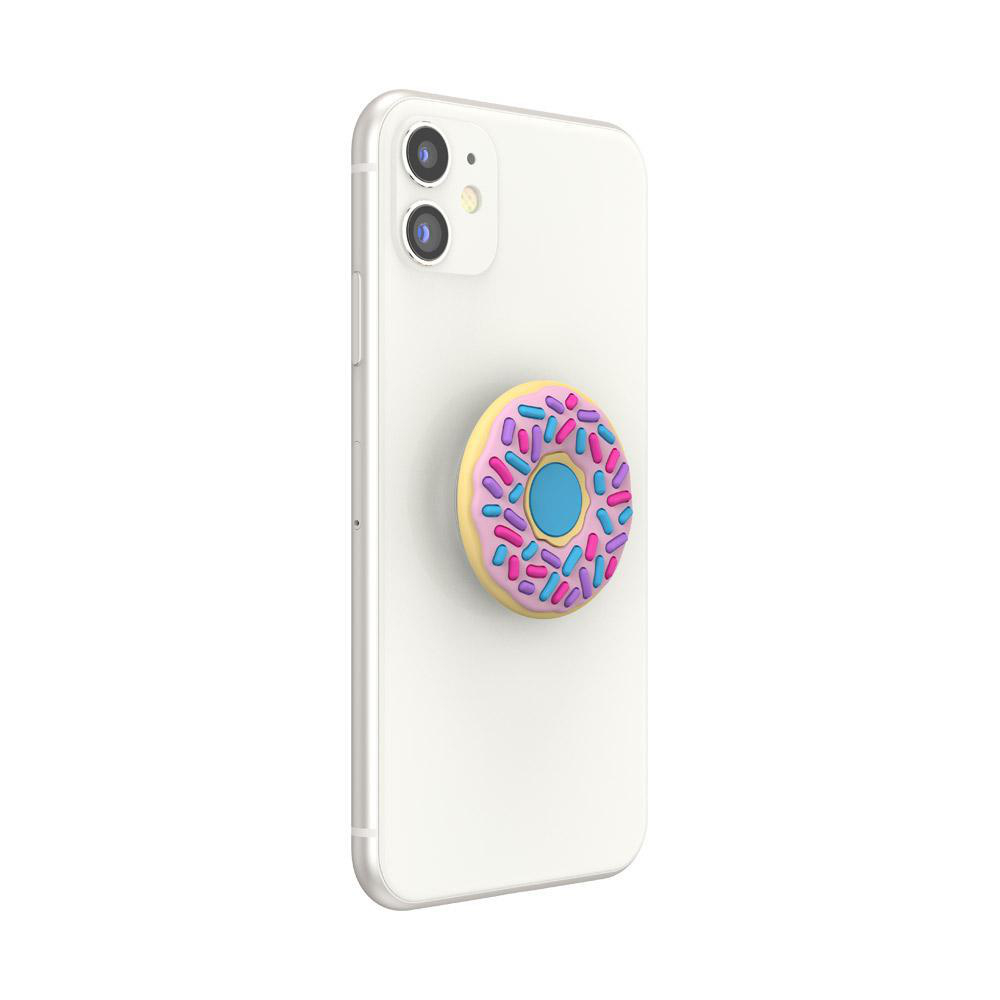 Ein weißes Telefon mit einem donut-förmigen PopSocket. Der PopSocket hat Streusel und ein rosa-blaues Design.