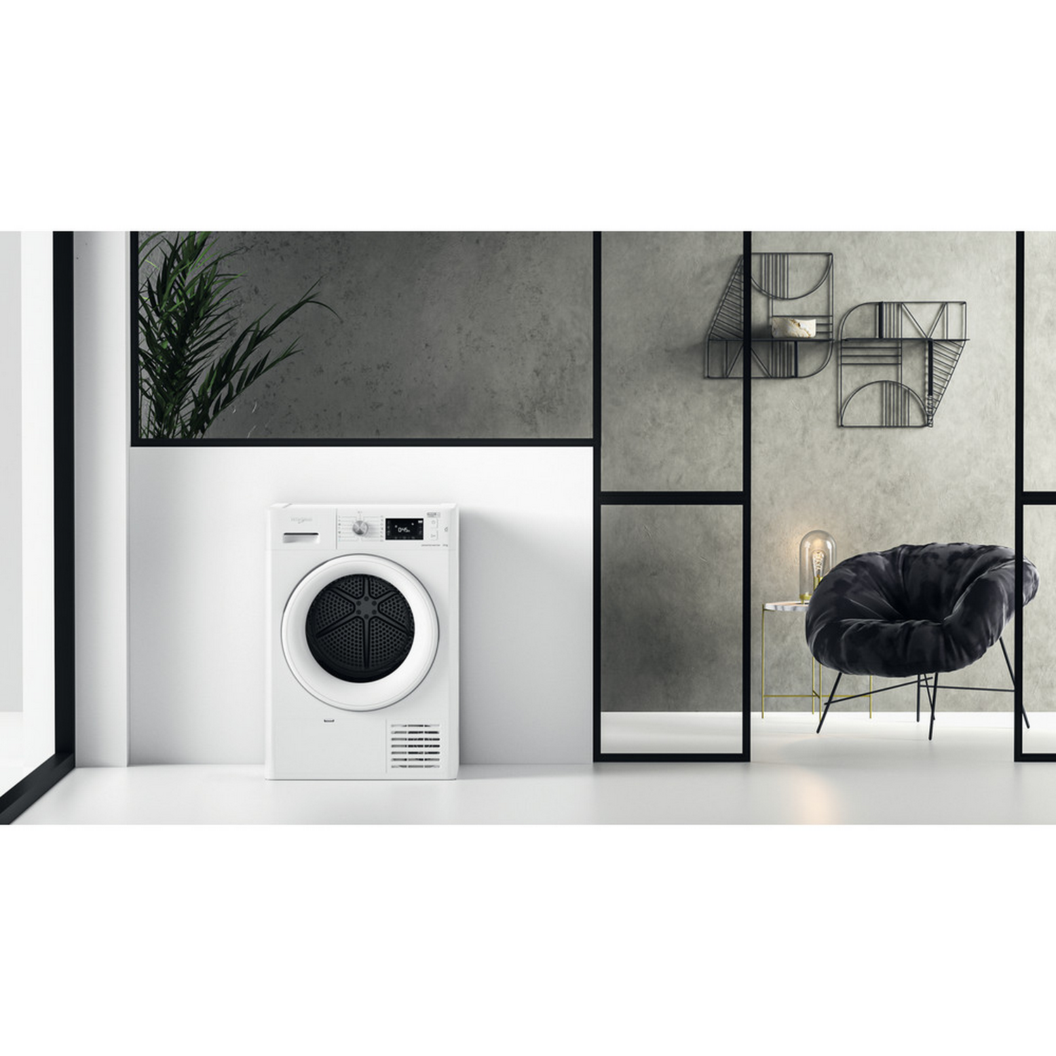 Secadora blanca. Diseño interior con silla negra, mesa auxiliar y decoración en la pared.