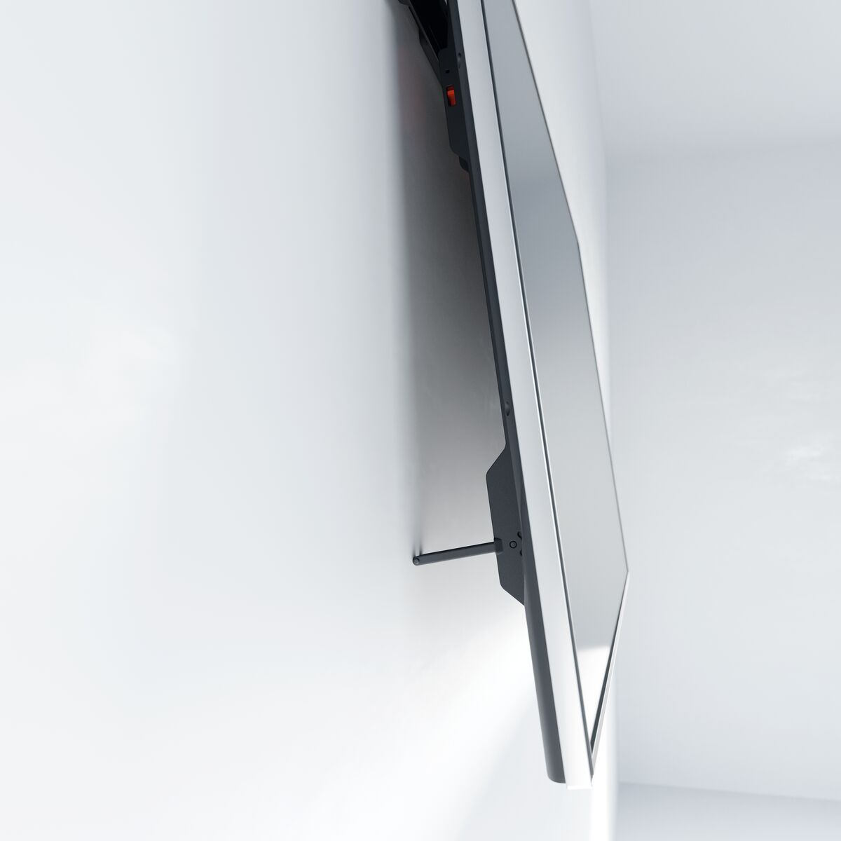 A large, flat-screen TV mounted on a white wall at a tilted angle. The TV is off.
