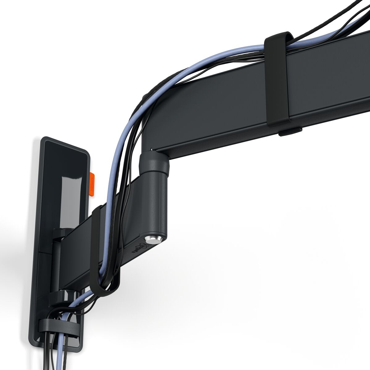Black, articulated wall mount with cables attached. Mounted on a white wall.