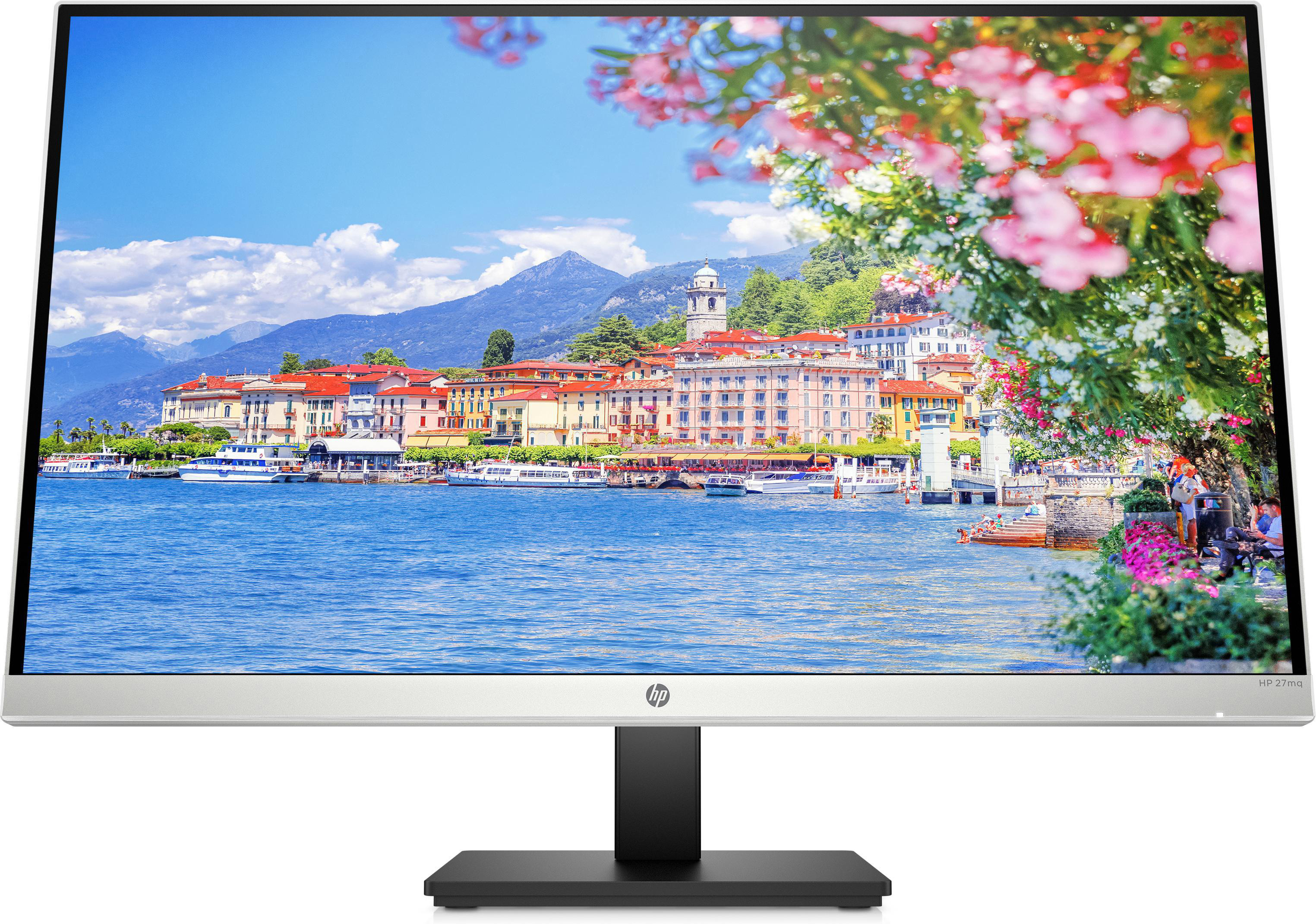 Ein Computermonitor zeigt eine Seelandschaft mit Bergen, Gebäuden und Blumen.