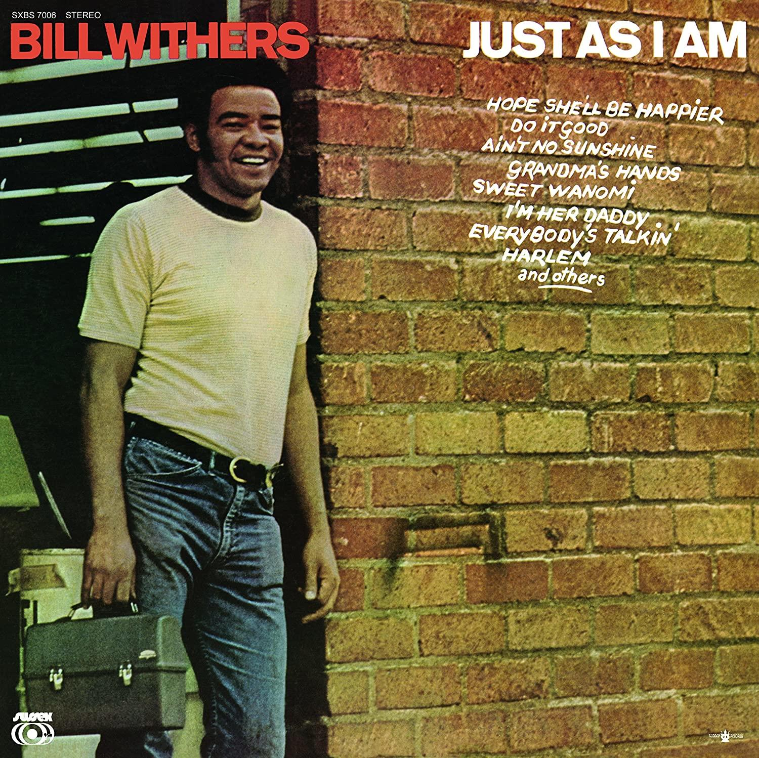 Bill Withers album borítója, mosolyog, egy téglából készült fal előtt. Az album címe: 'Just As I Am'.