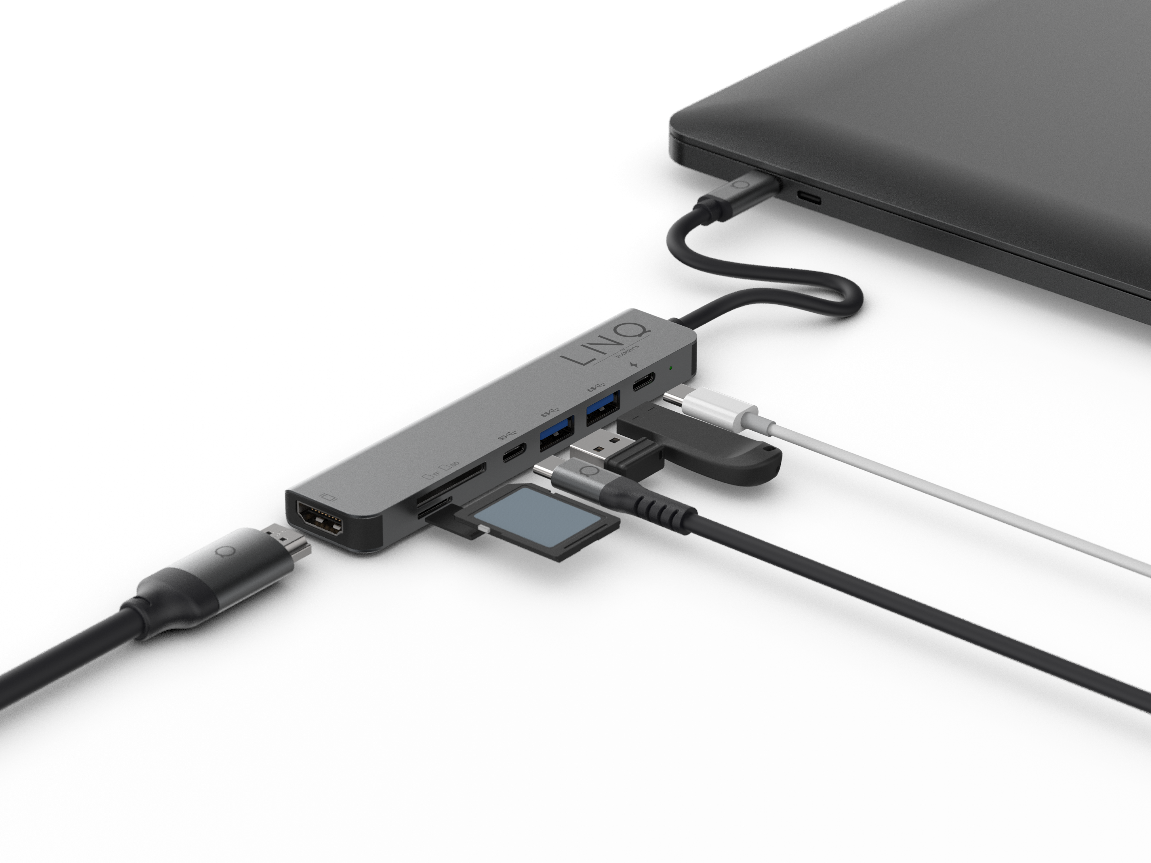 Een grijze USB-C hub aangesloten op een laptop, met diverse poorten en kabels.