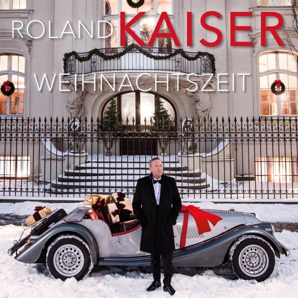 Roland Kaiser Albumcover: Mann vor Haus mit Auto. Schnee und Weihnachtsdekoration.