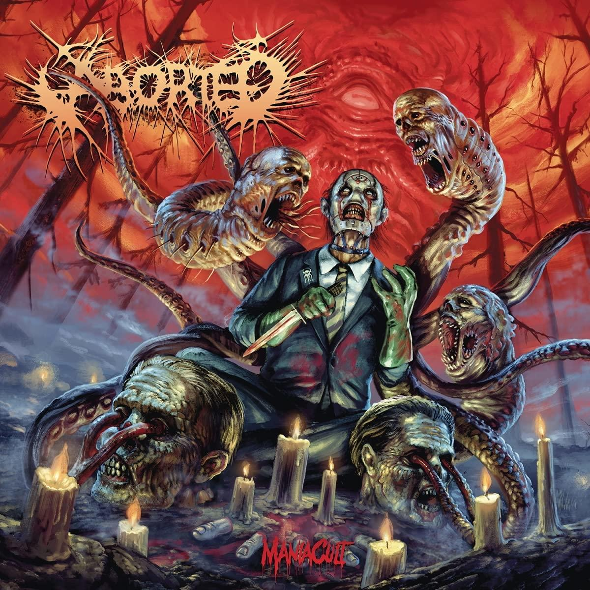 Albumcover mit verstörender Szene. Ein Mann im Anzug, umgeben von Monstern, hält ein Messer. Roter Hintergrund.