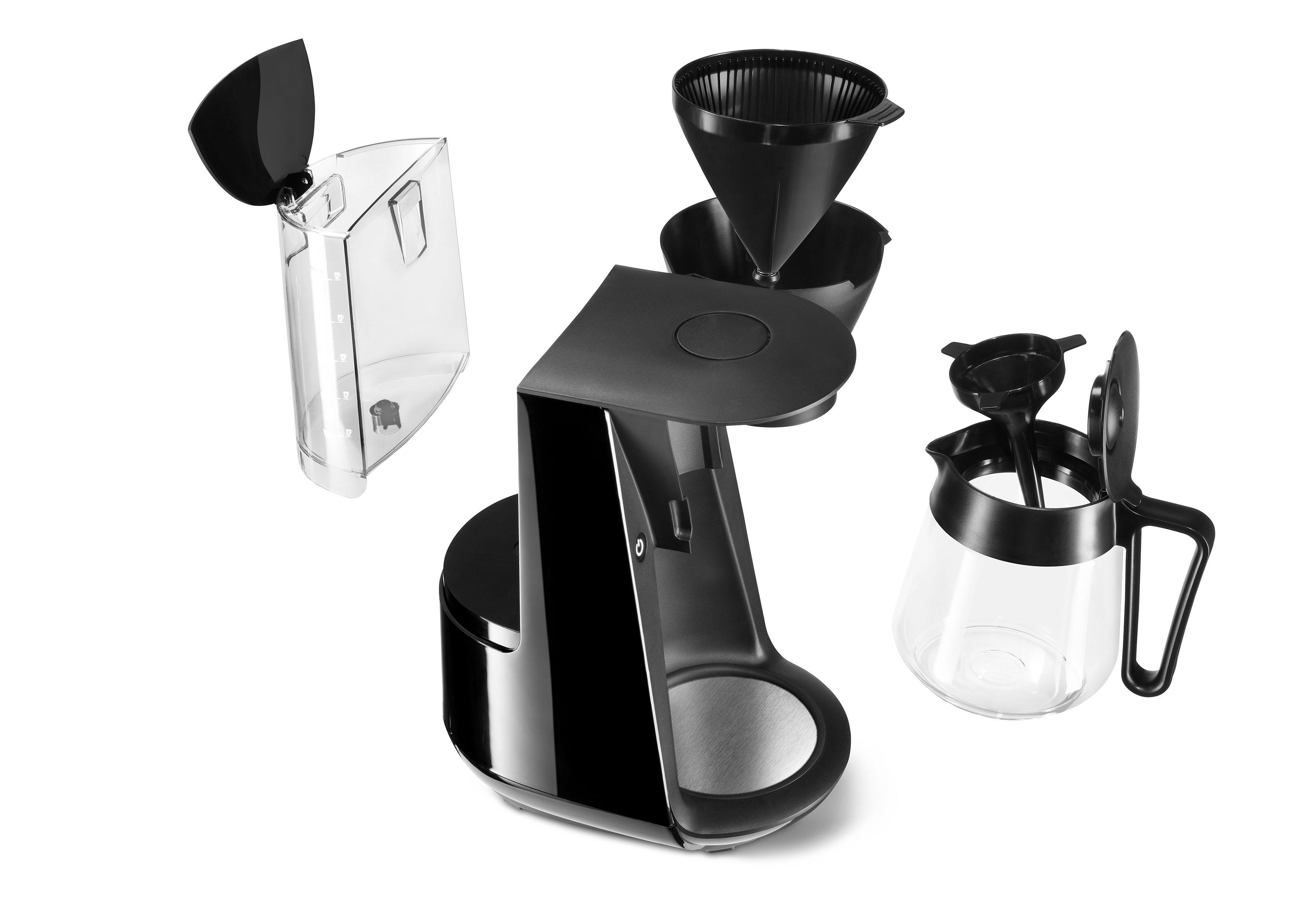 Schwarze und silberne Kaffeemaschinenteile zerlegt.