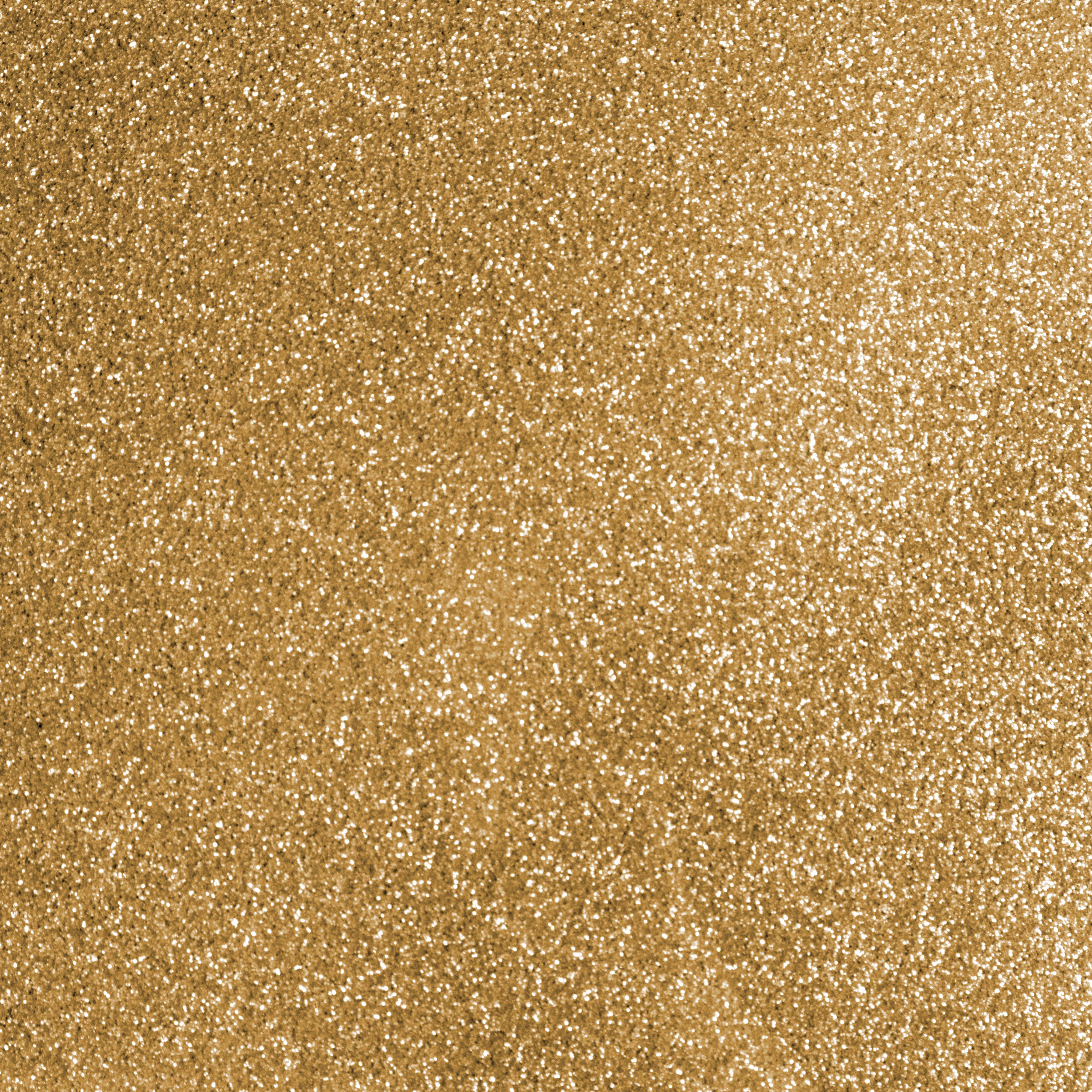 Nahaufnahme einer goldenen Glitzertextur. Die Oberfläche ist mit winzigen, funkelnden Partikeln bedeckt, die einen schimmernden Effekt erzeugen.