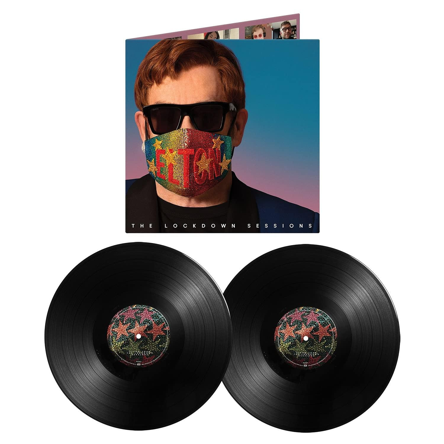 Elton John Albumcover mit Maske und zwei Schallplatten.