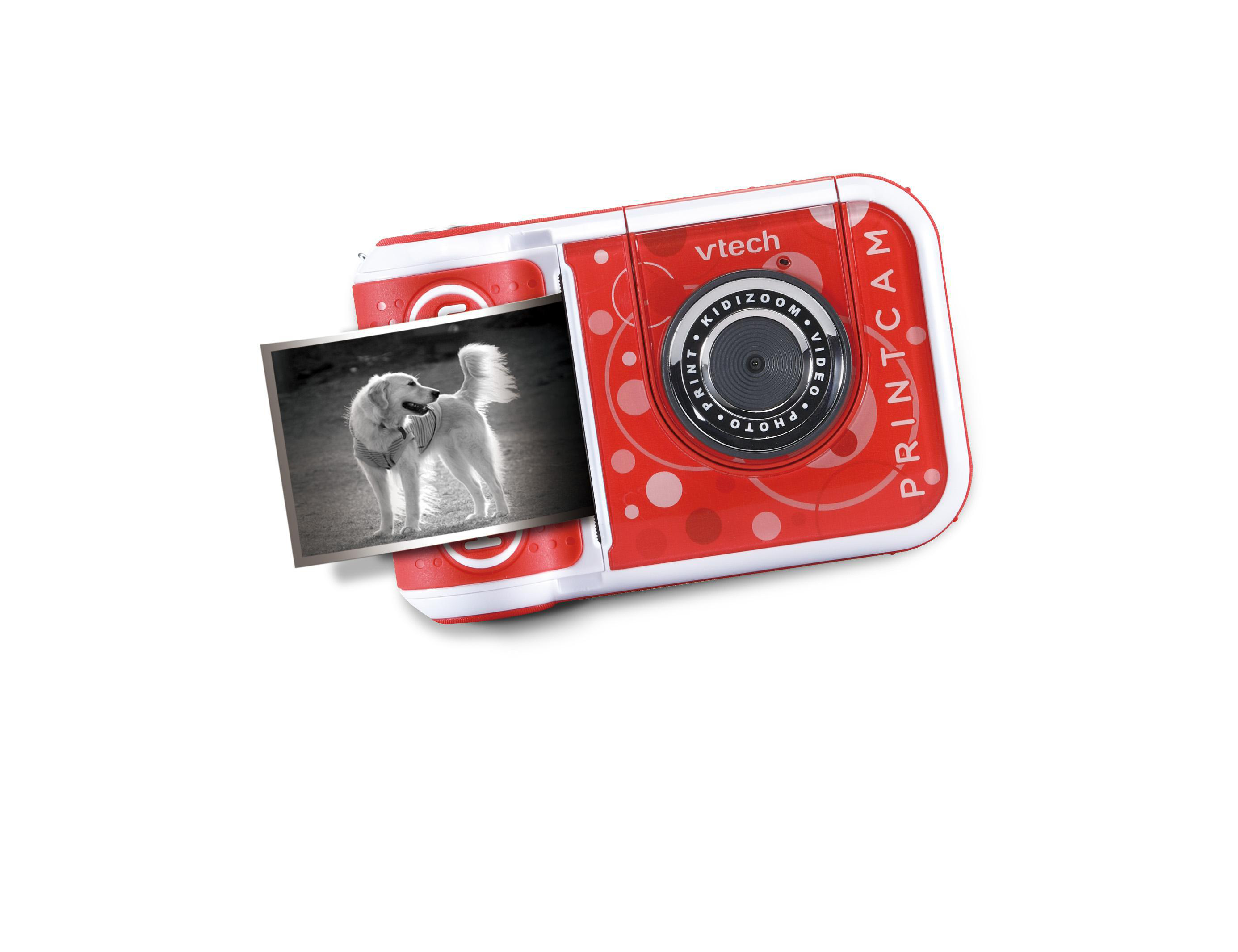 Rote VTech Kidizoom PrintCam mit einem gedruckten Foto eines Hundes, auf weißem Hintergrund.