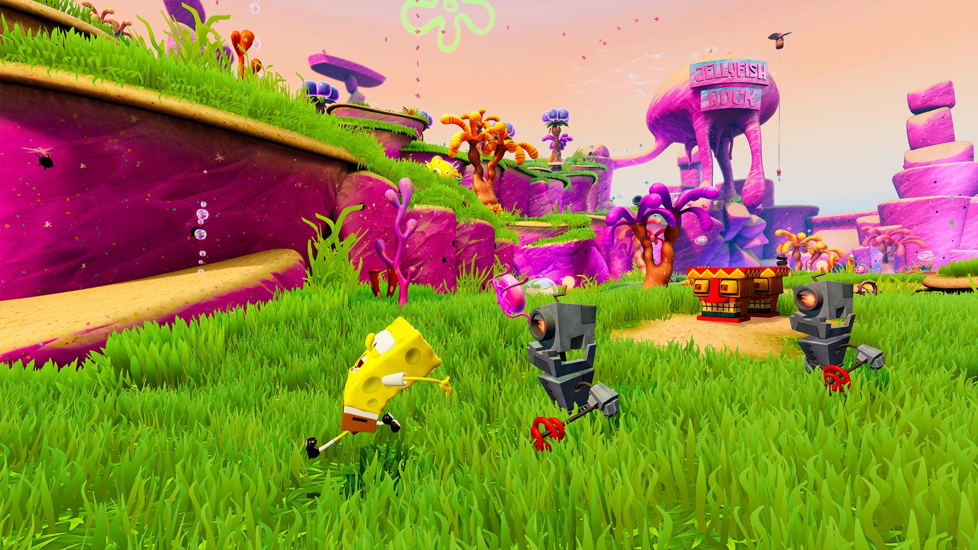 SpongeBob SquarePants in einer bunten, cartoonartigen Landschaft mit Robotern und Jellyfish Rock im Hintergrund.