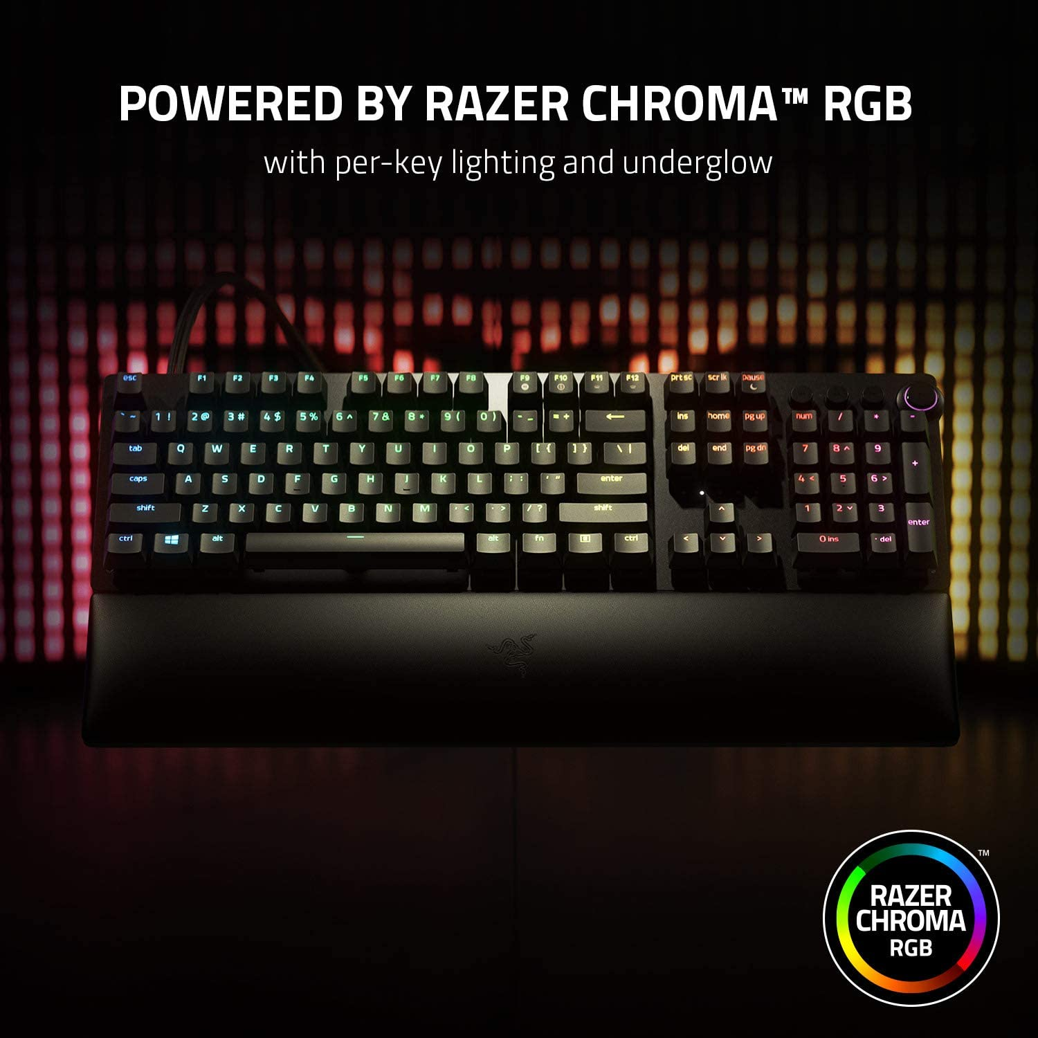 Teclado Razer Chroma RGB, negro con teclas iluminadas de colores. Reposamuñecas negro. Fondo oscuro.