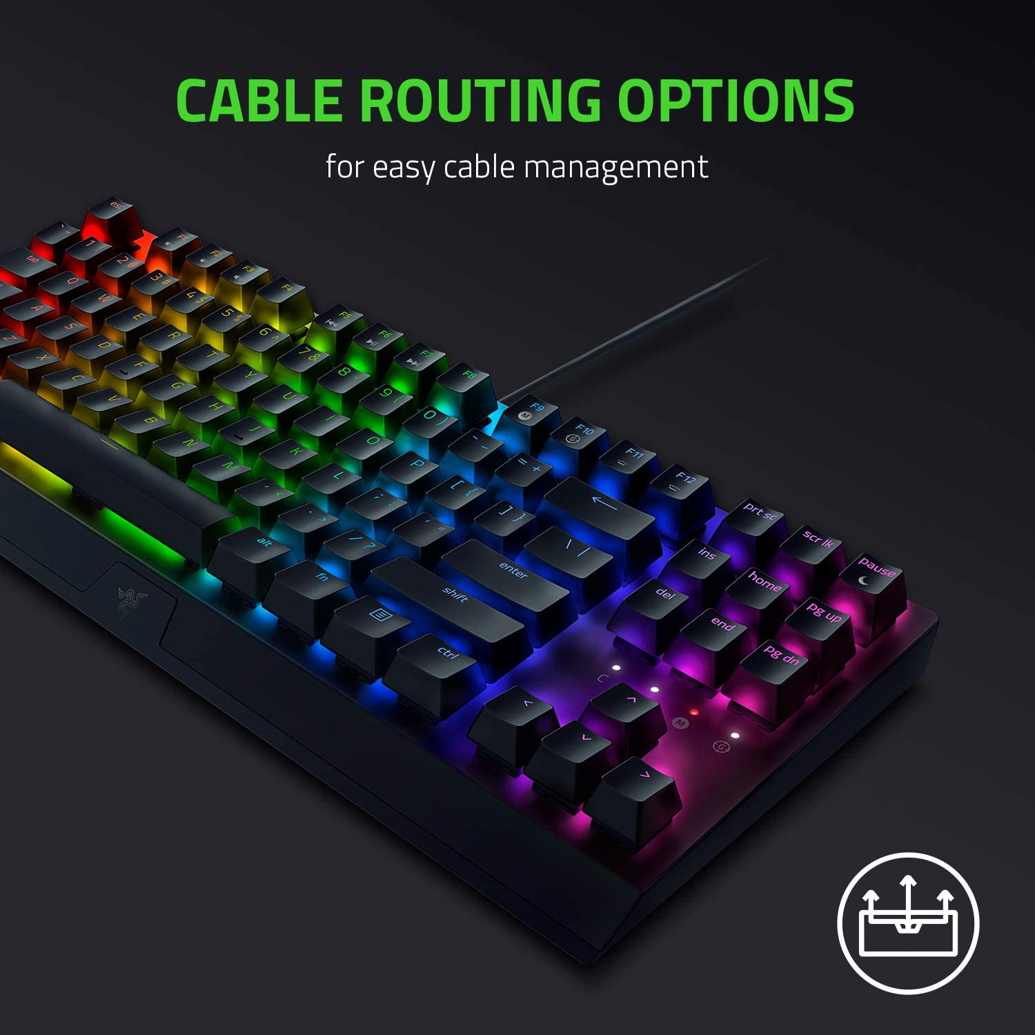 Un teclado Razer negro con teclas iluminadas que muestran múltiples colores y texto sobre opciones de enrutamiento de cables.