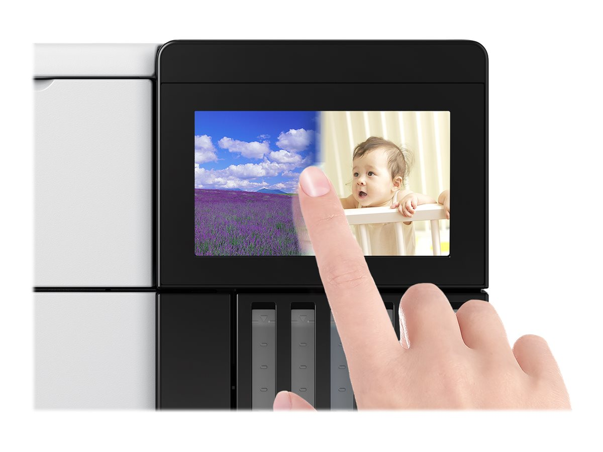 Ein Finger berührt einen Bildschirm mit einem Lavendelfeld und einem Baby in einem Kinderbett.