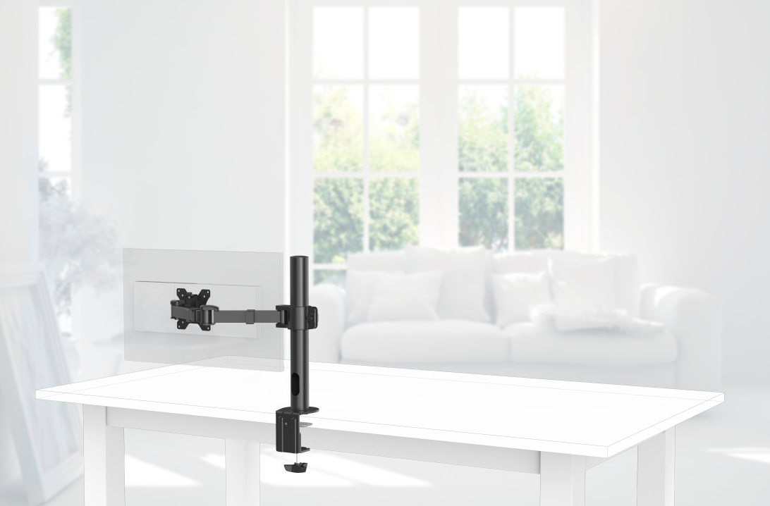 Un bras de moniteur est sur un bureau blanc. Le moniteur est fixé au bras.
