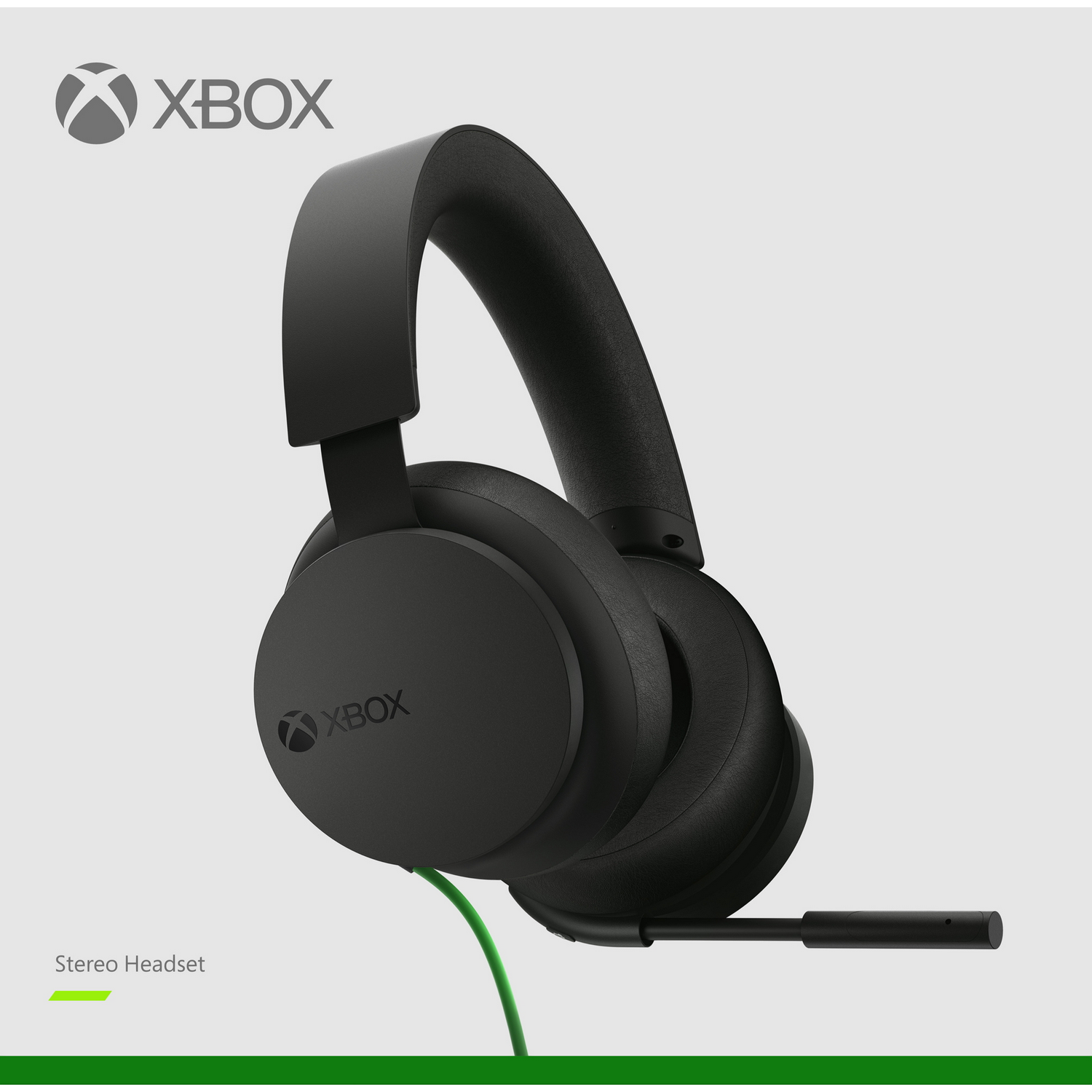 Auriculares estéreo Xbox negros. Cable verde y fondo blanco con el logotipo de Xbox.